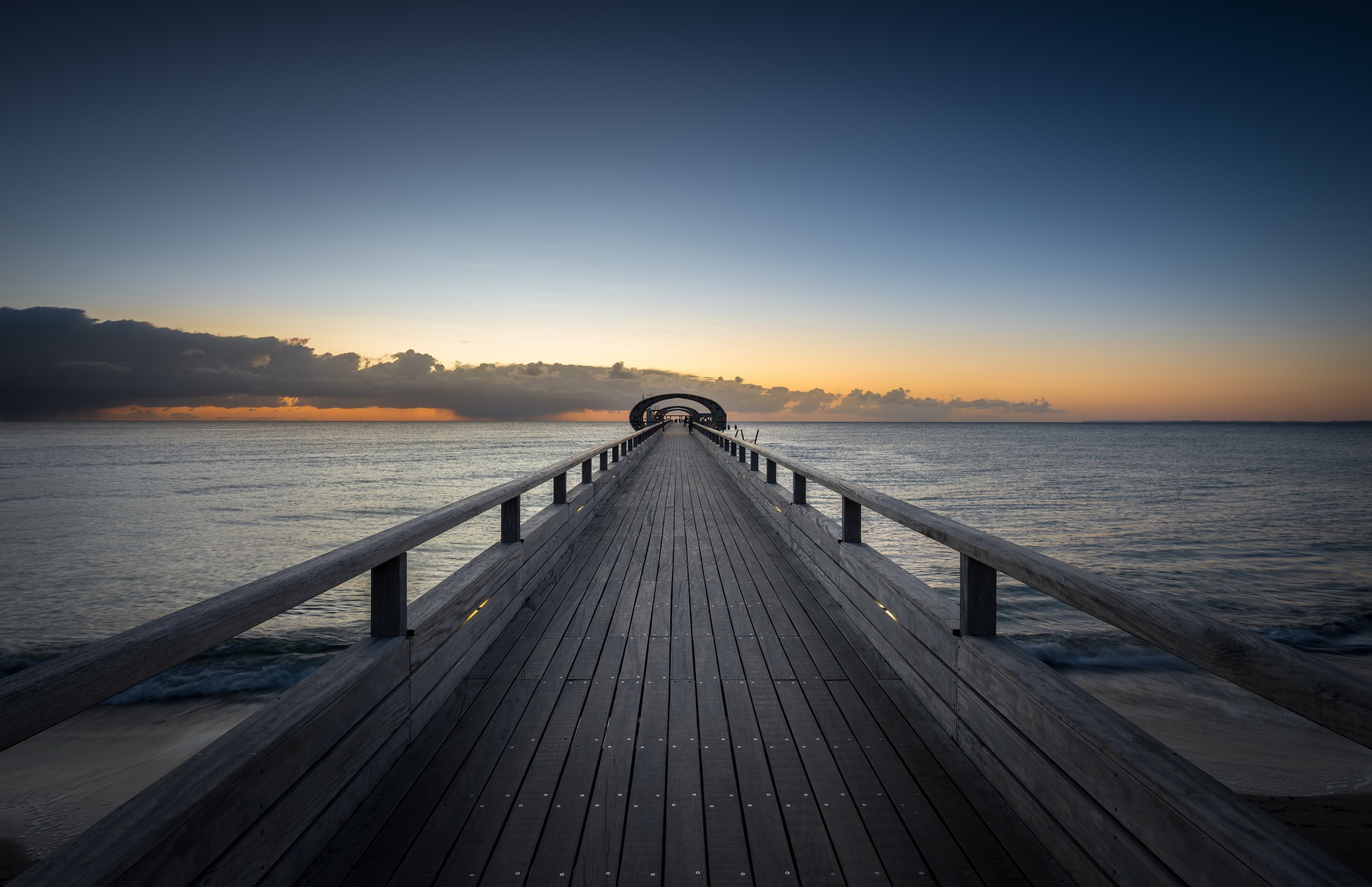 Wooden pier over the sea at sunset HD Wallpaper