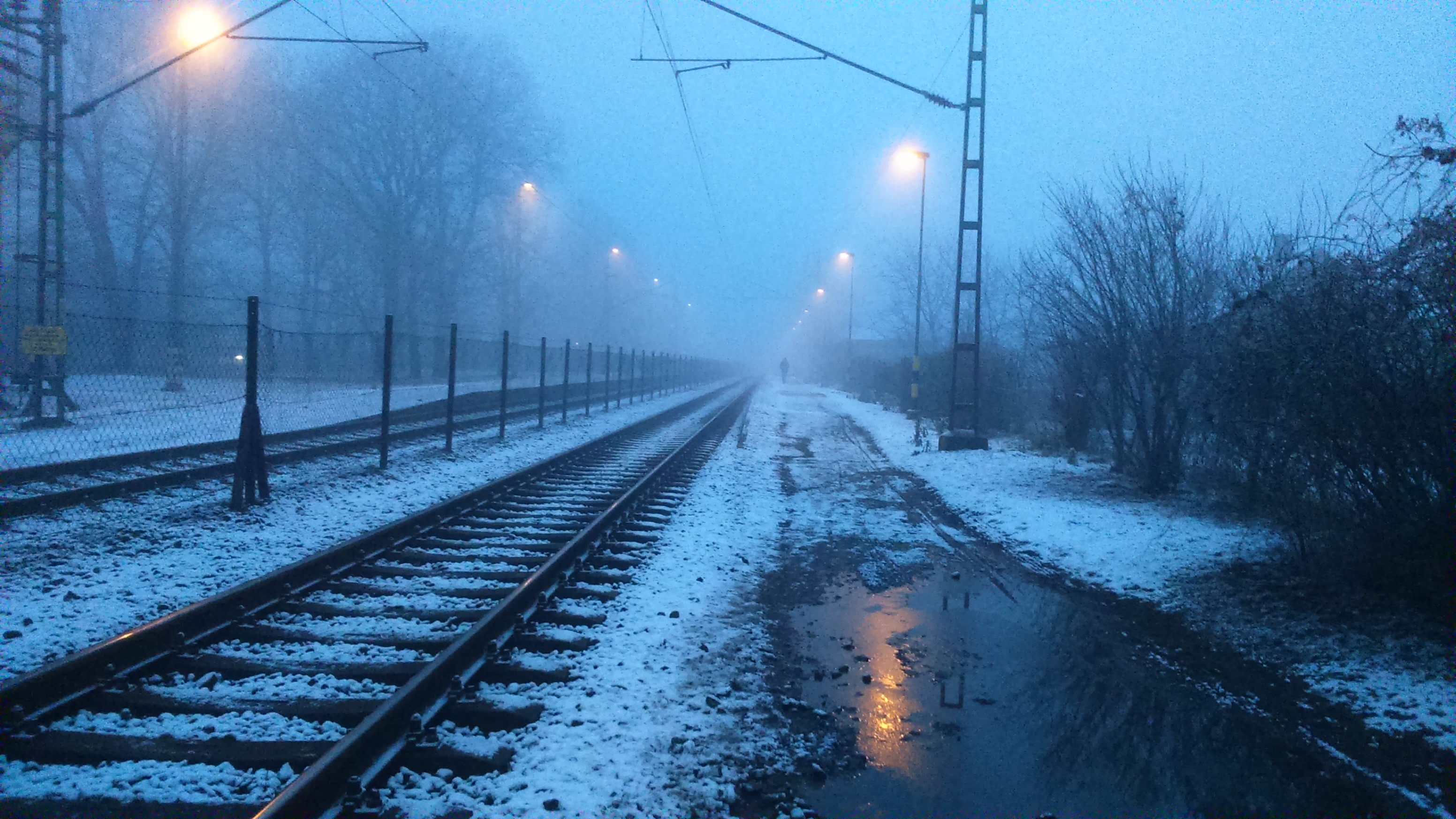 Snowy railway station in mist, Tiszaluc, Hungary HD Wallpaper