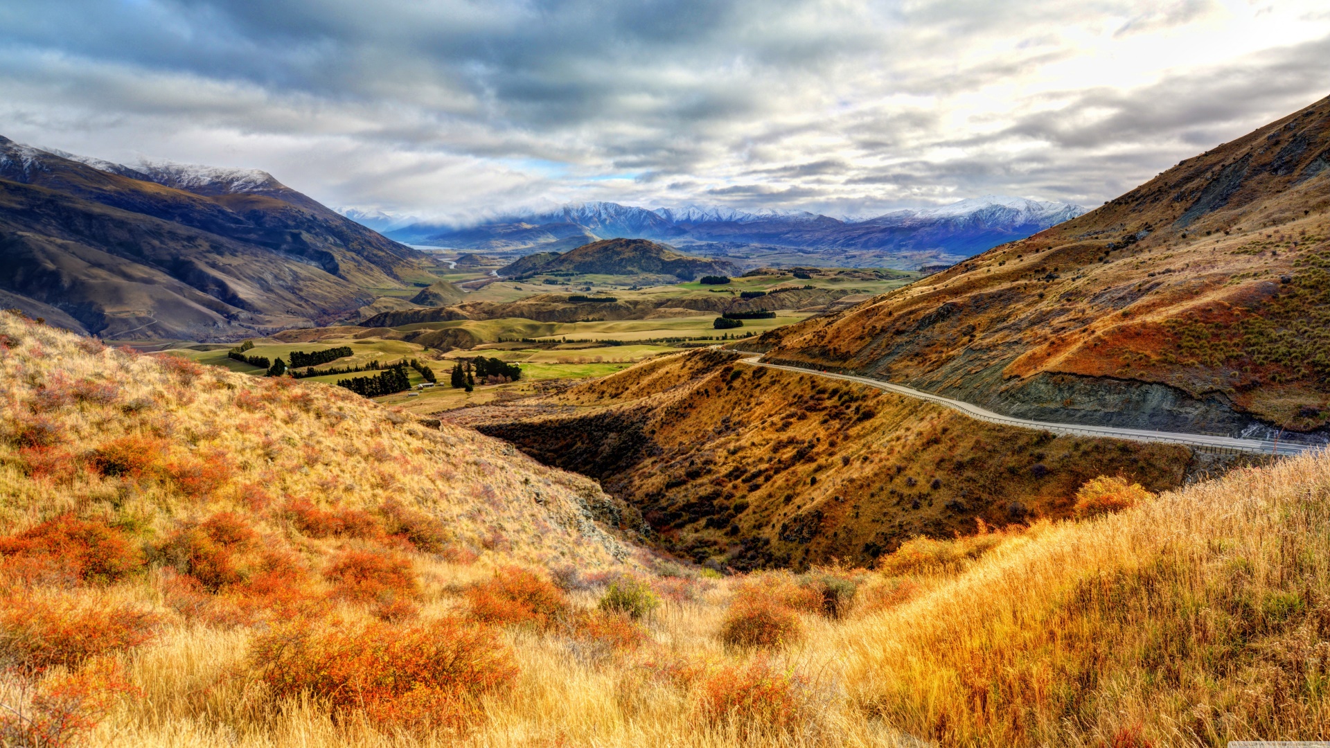 Mountain valley landscape with winding road HD Wallpaper