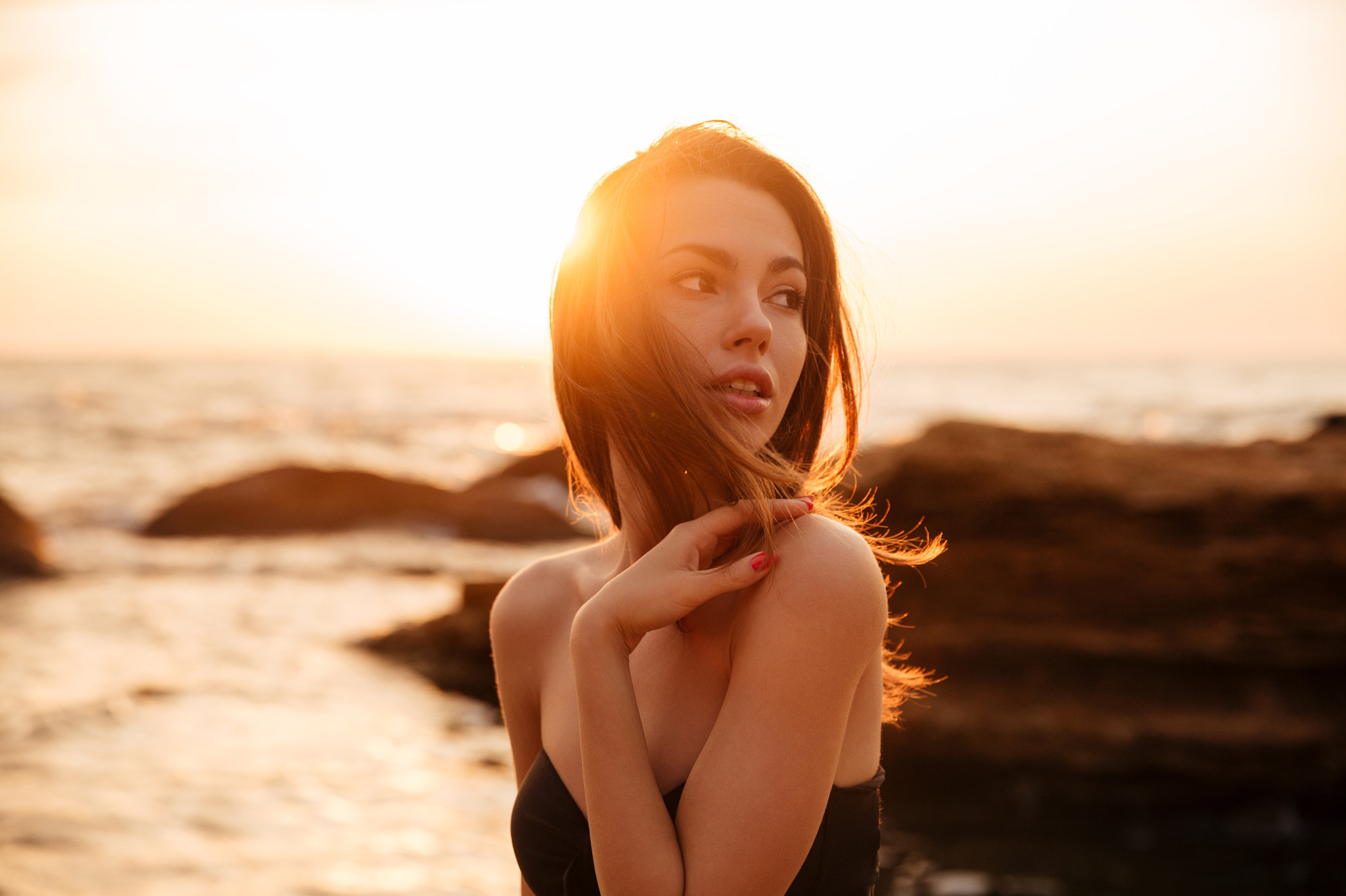 Woman on beach at sunset HD Wallpaper