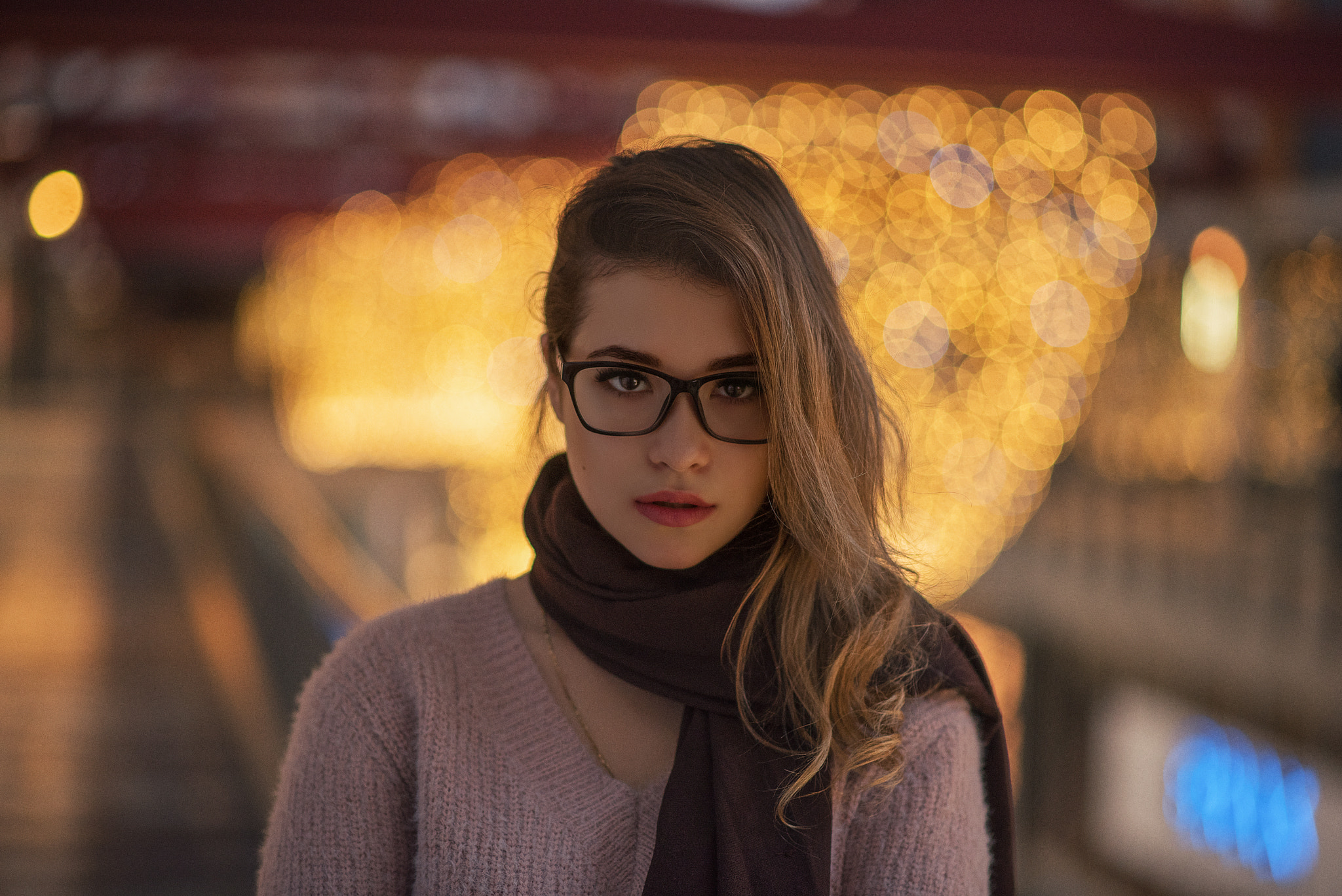Woman with glasses and scarf in bokeh lights HD Wallpaper