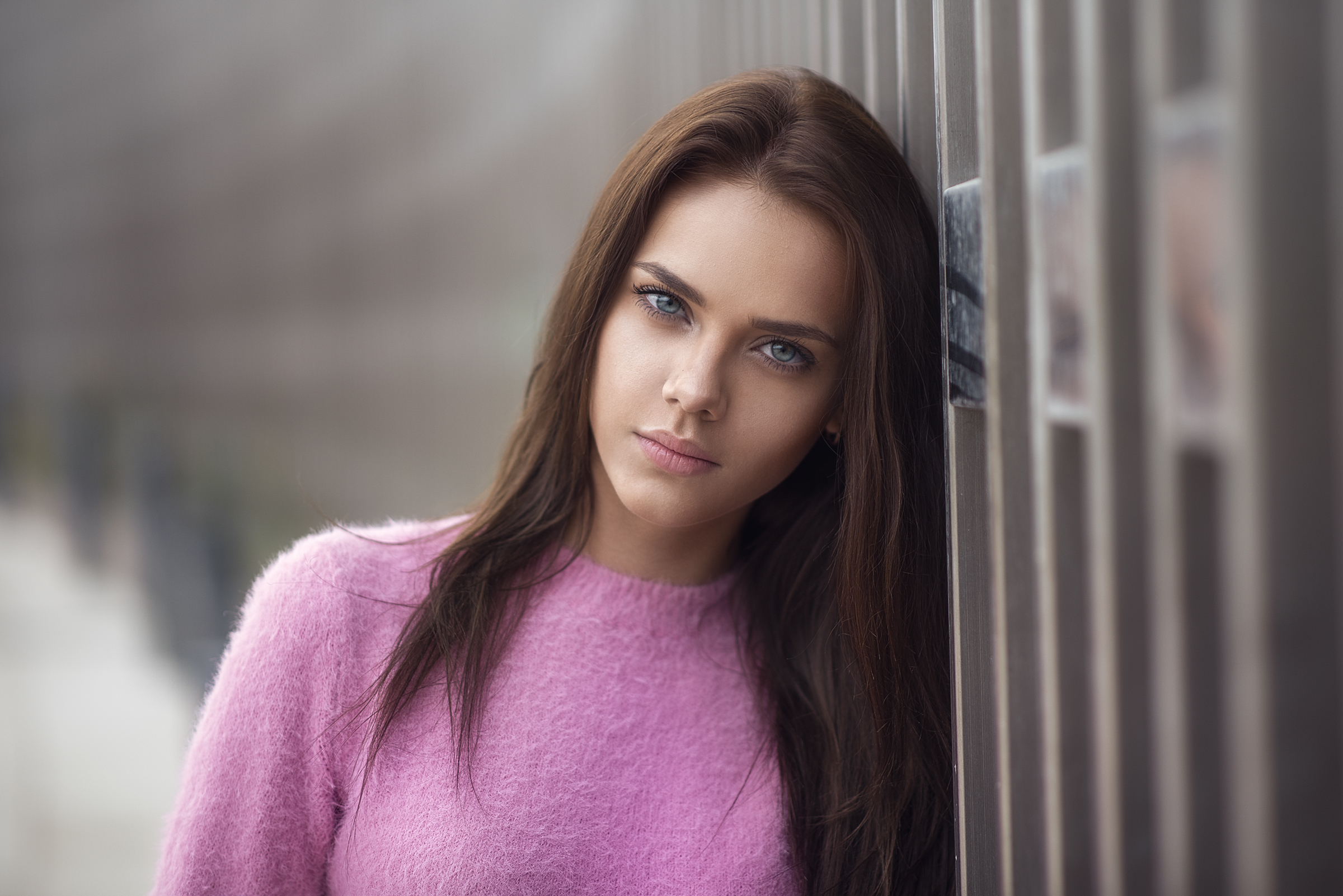 Woman with blue eyes wearing a pink sweater HD Wallpaper