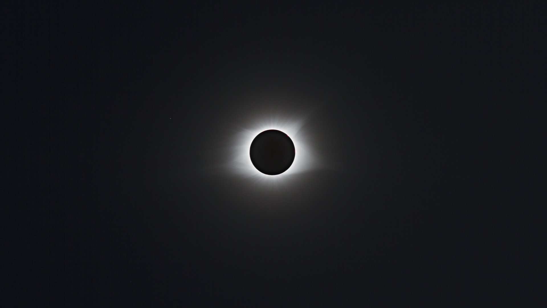 Total solar eclipse with visible corona HD Wallpaper