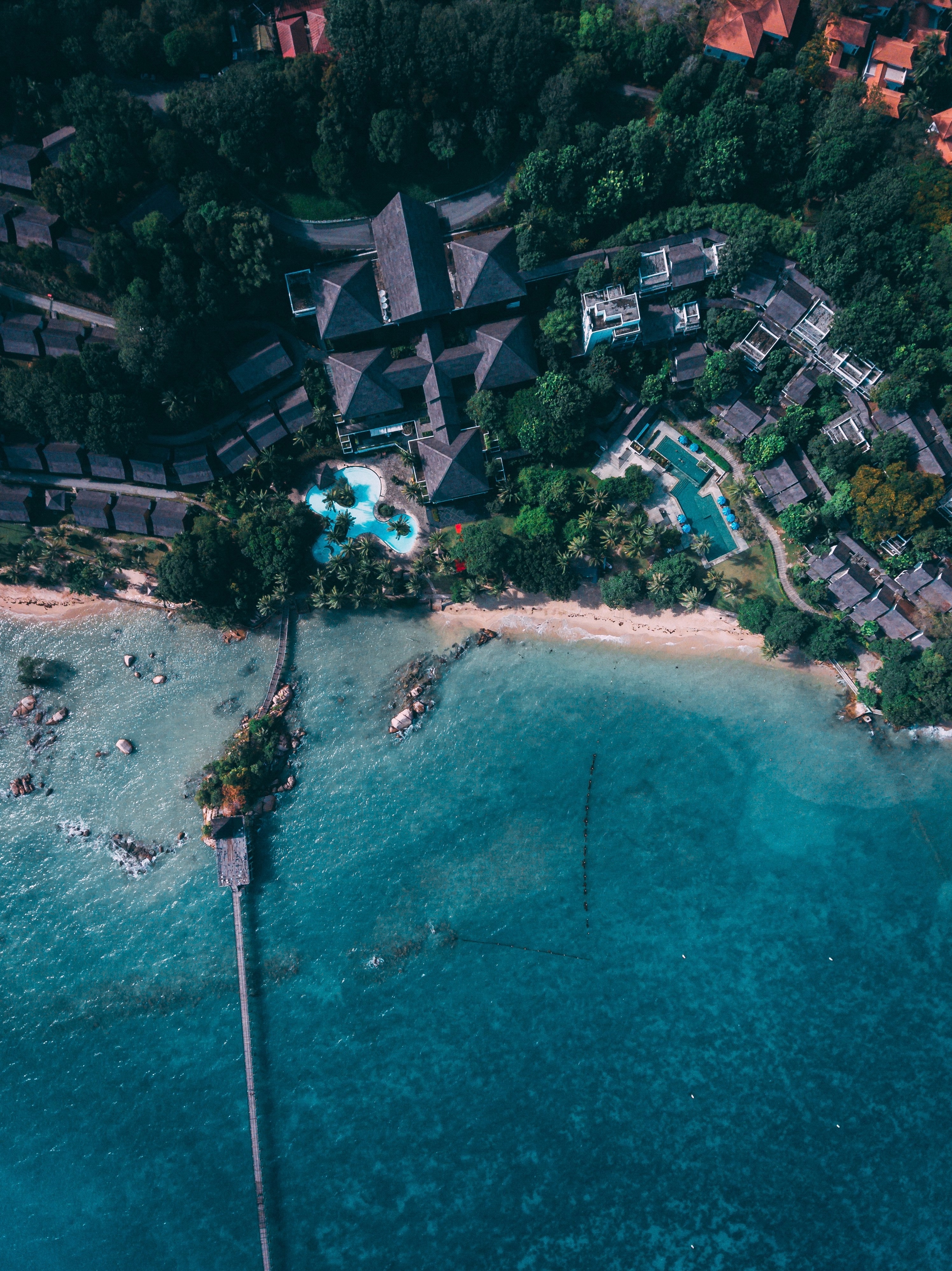 Aerial view of a tropical resort with a pier HD Wallpaper