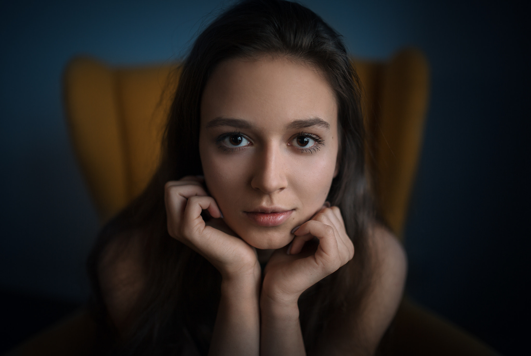 Woman sitting in a yellow chair HD Wallpaper