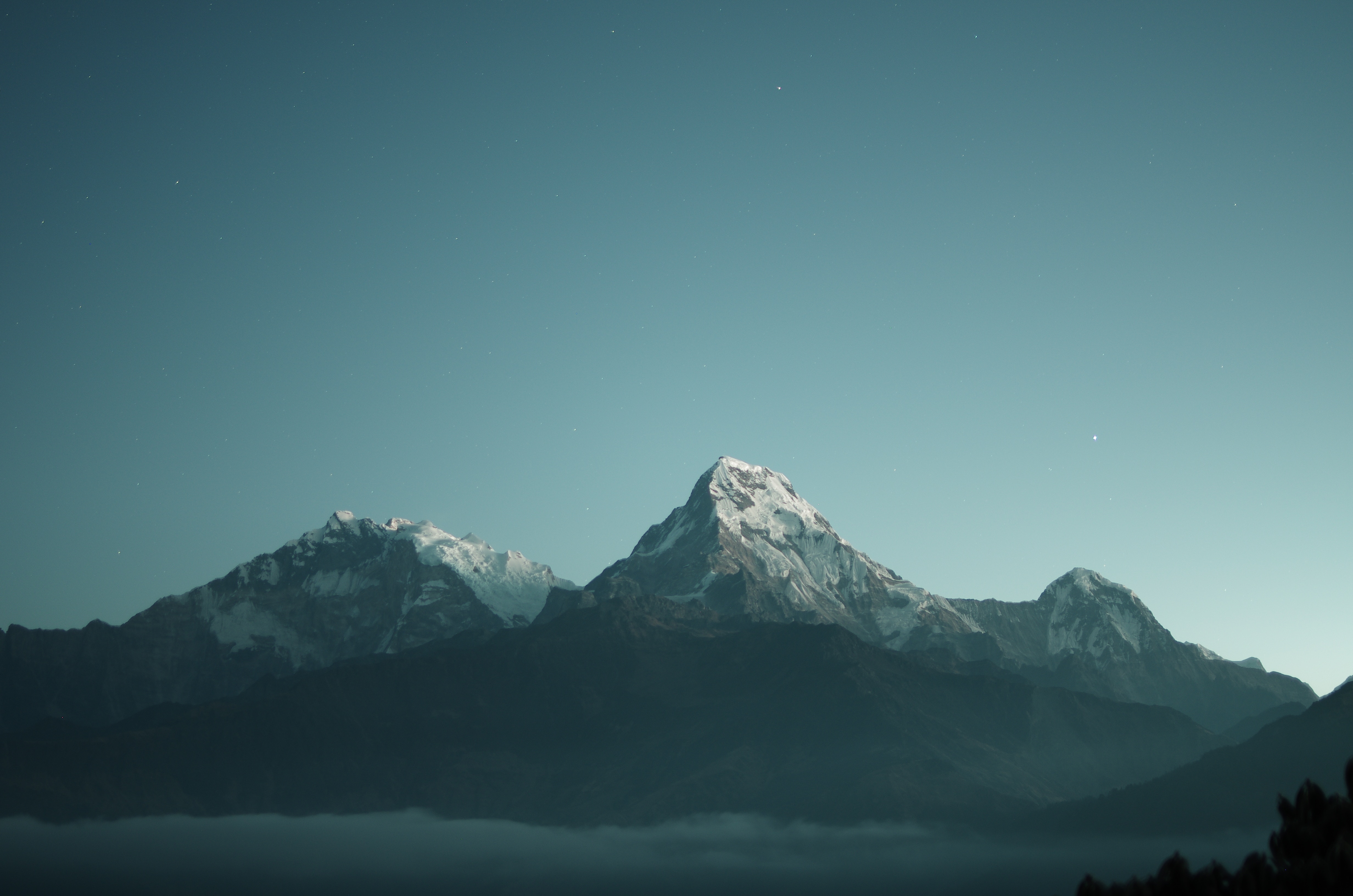 Snow-capped mountains under a starry sky HD Wallpaper