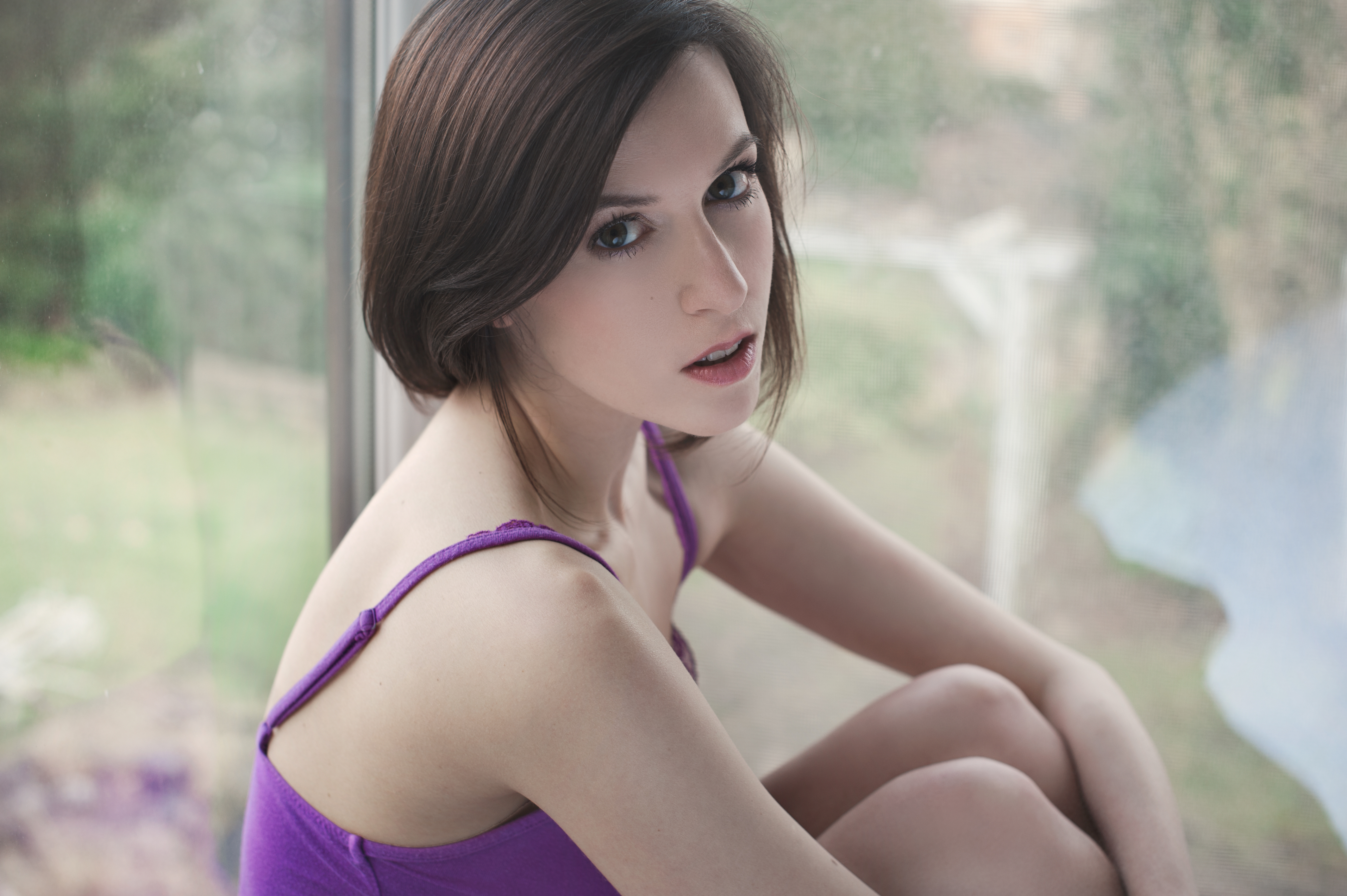 Woman with short brown hair wearing a purple top HD Wallpaper