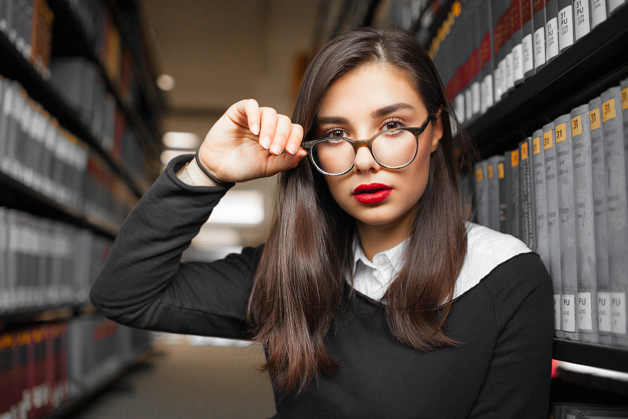Woman with glasses and red lipstick in library HD Wallpaper