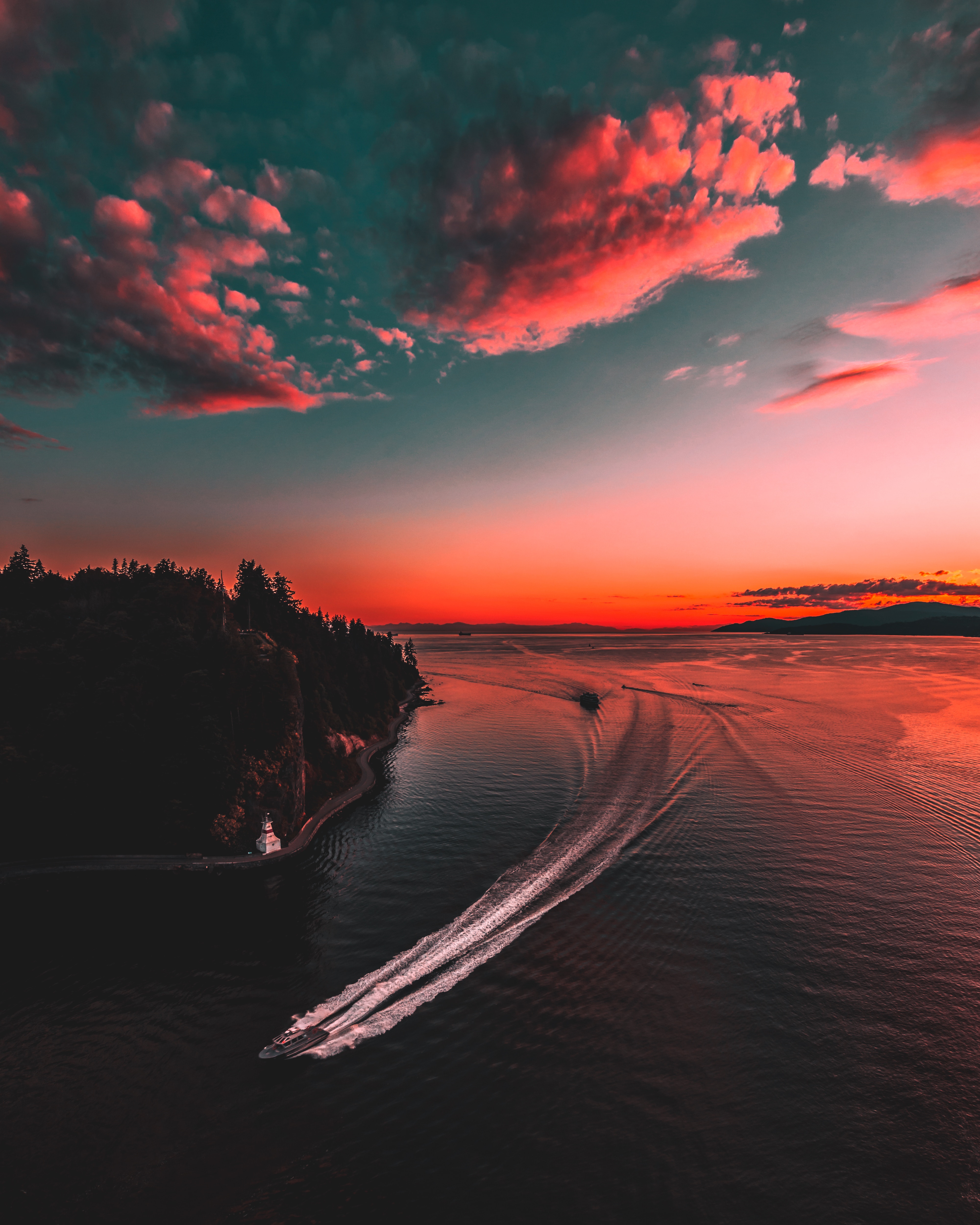 Boats on the water during a vibrant sunset in Vancouver HD Wallpaper