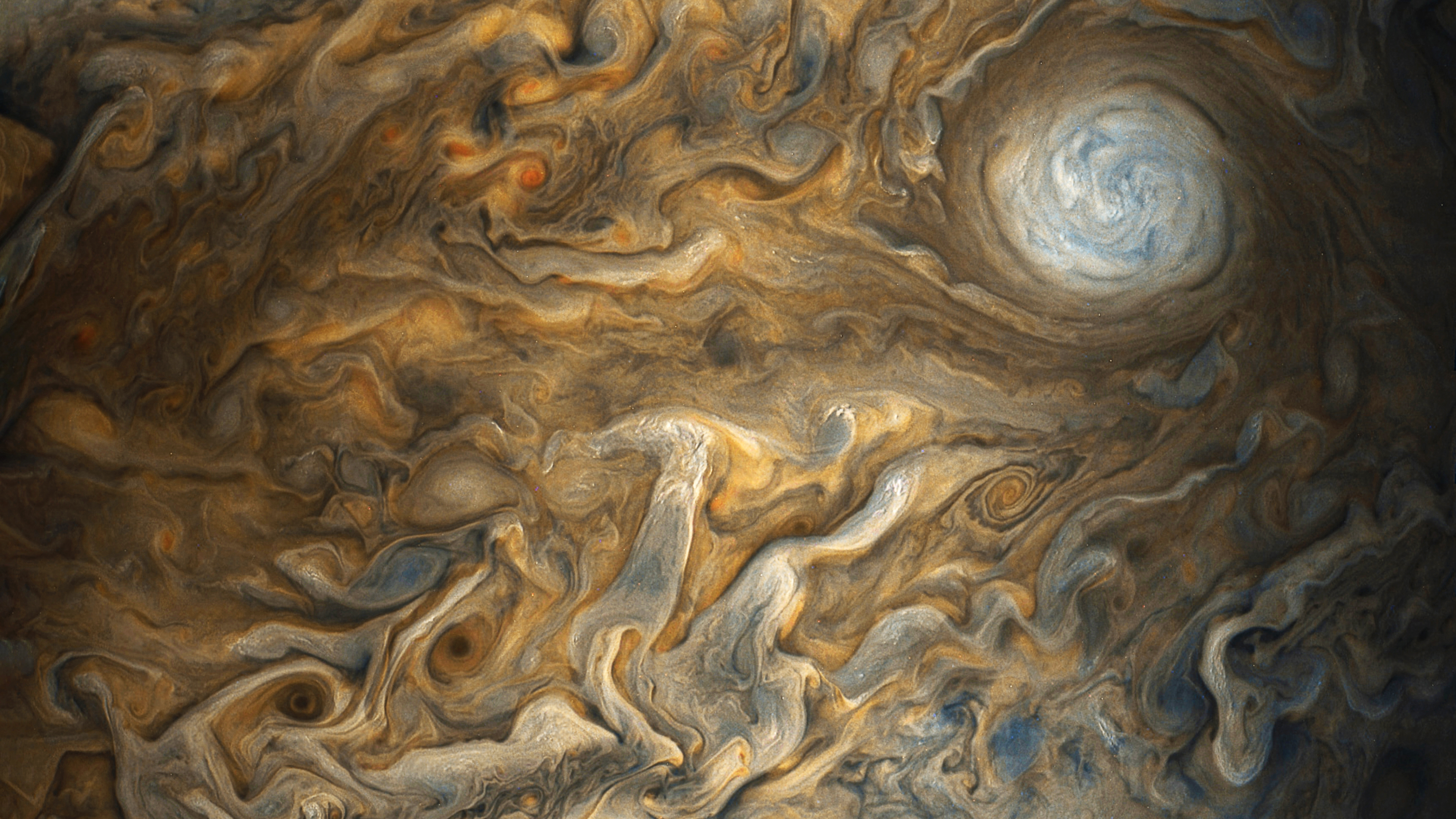 Jupiter's swirling clouds and storms HD Wallpaper
