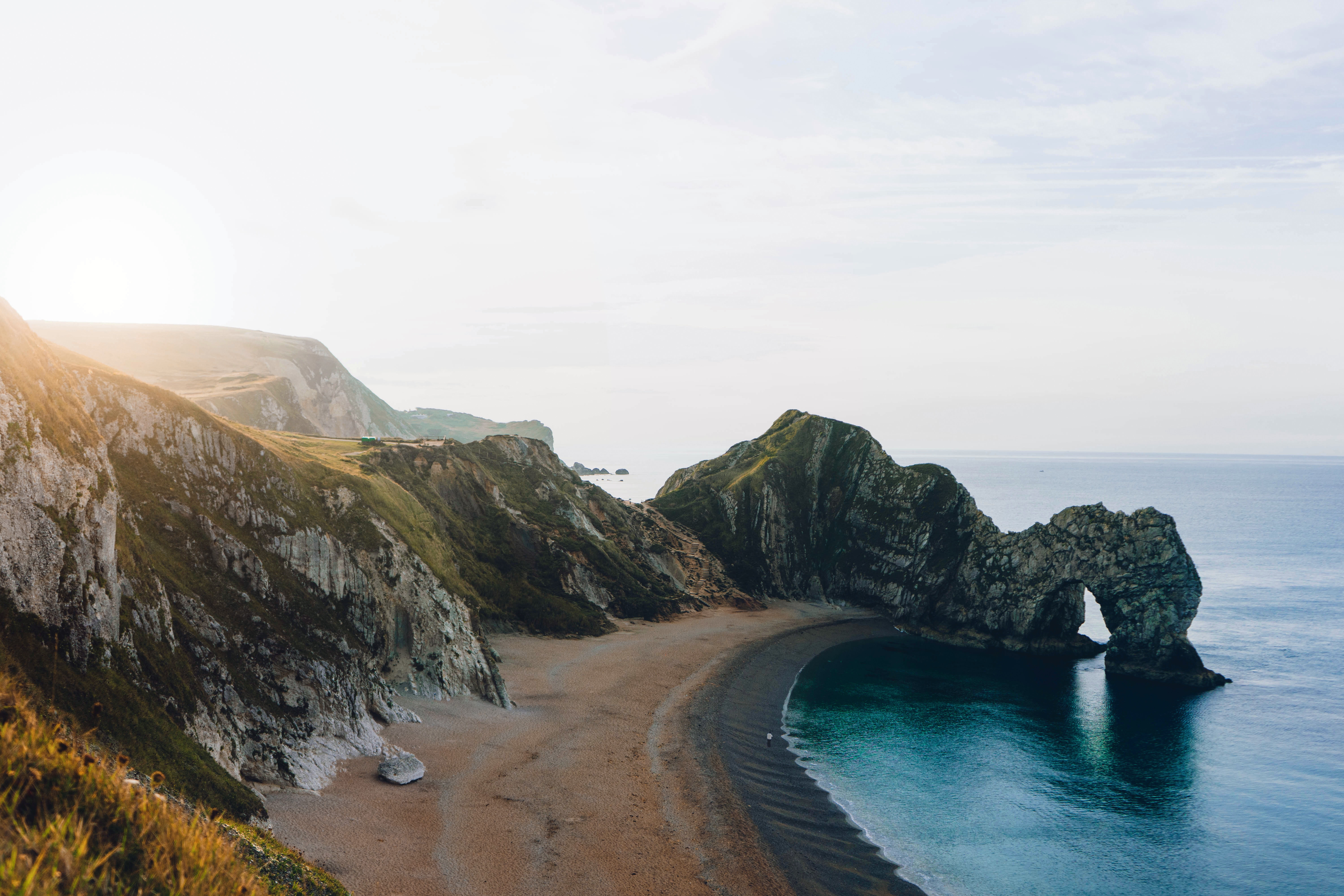 Durdle Door beach and cliffs at sunrise HD Wallpaper