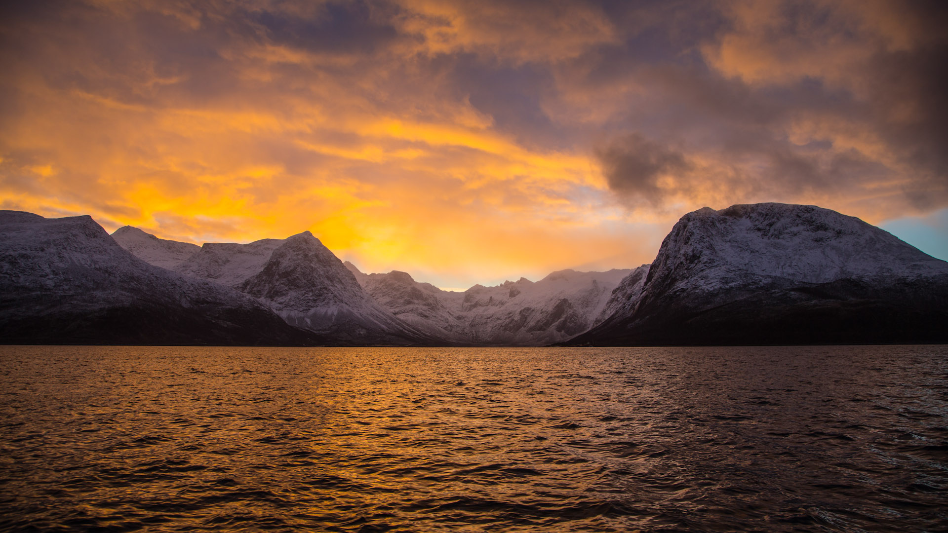 Snowy mountains over a lake at sunset HD Wallpaper