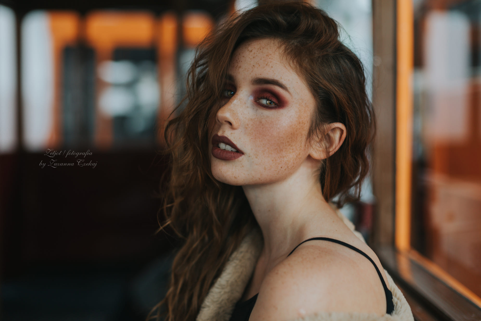 Portrait of a woman with freckles and makeup HD Wallpaper