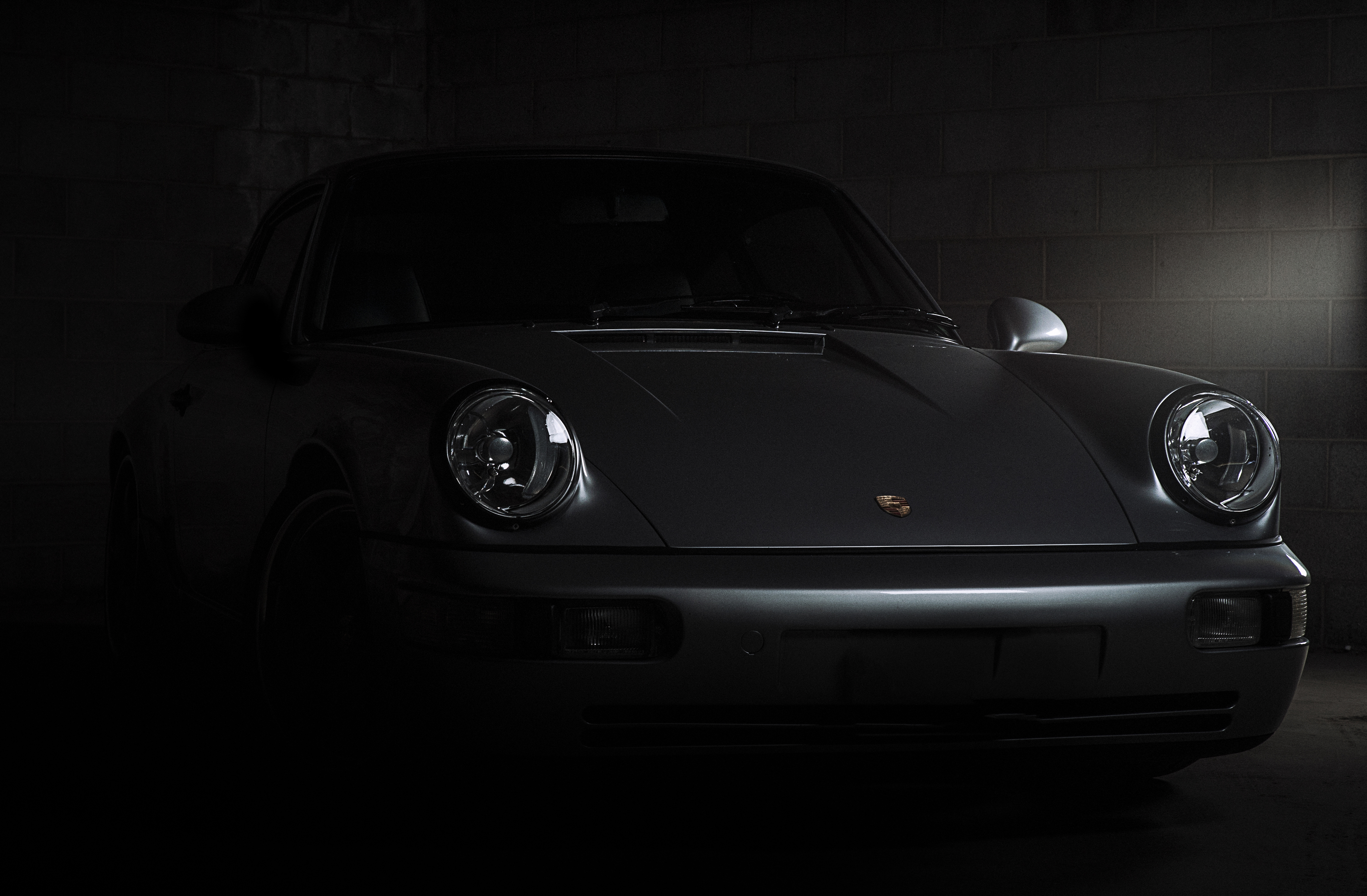 Porsche 911 Carrera in a dark garage HD Wallpaper