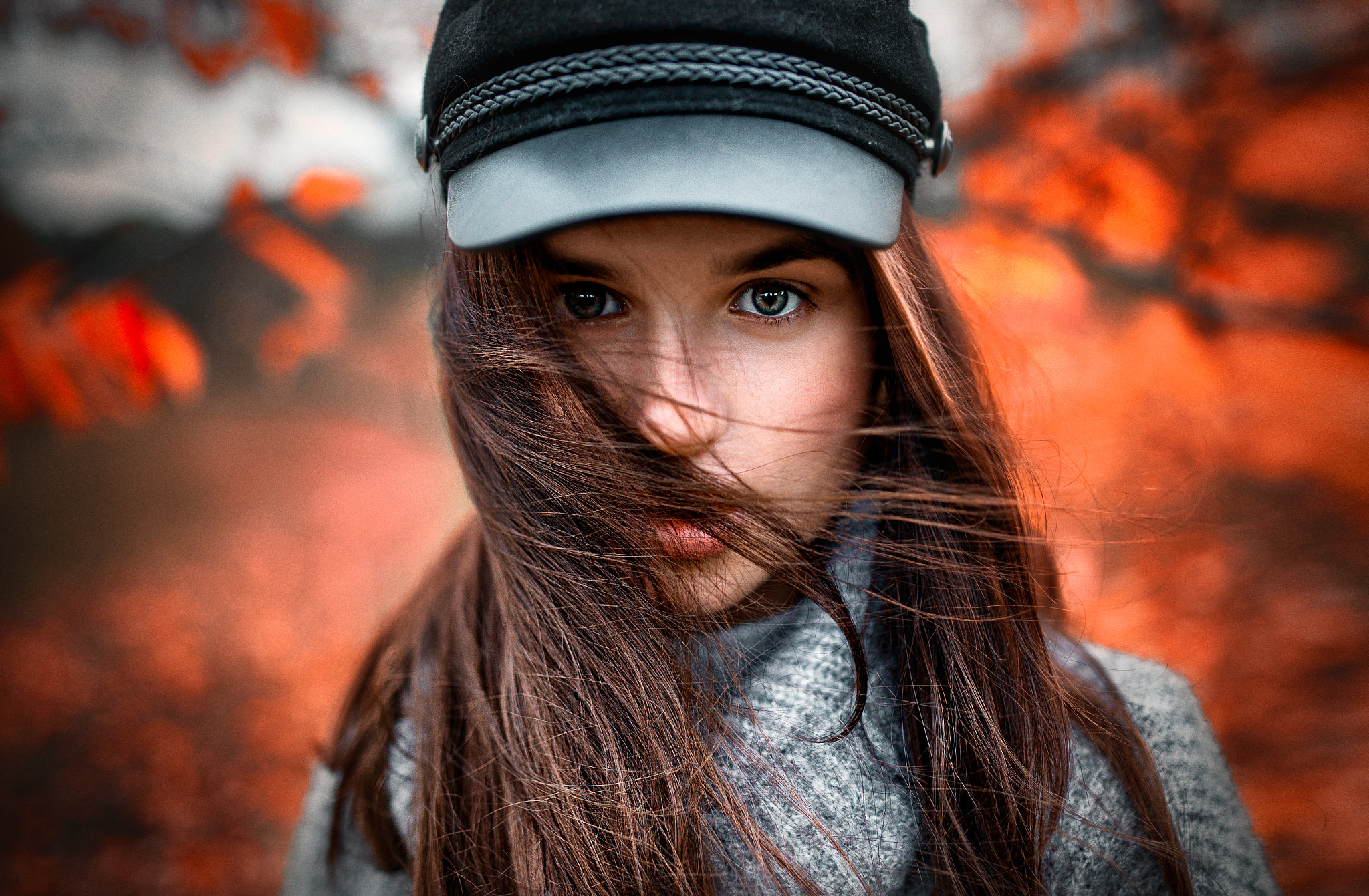 Portrait of a young woman with windblown hair HD Wallpaper
