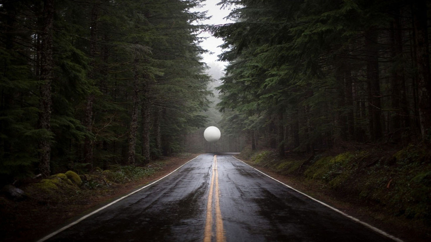 White sphere floating over a wet forest road HD Wallpaper