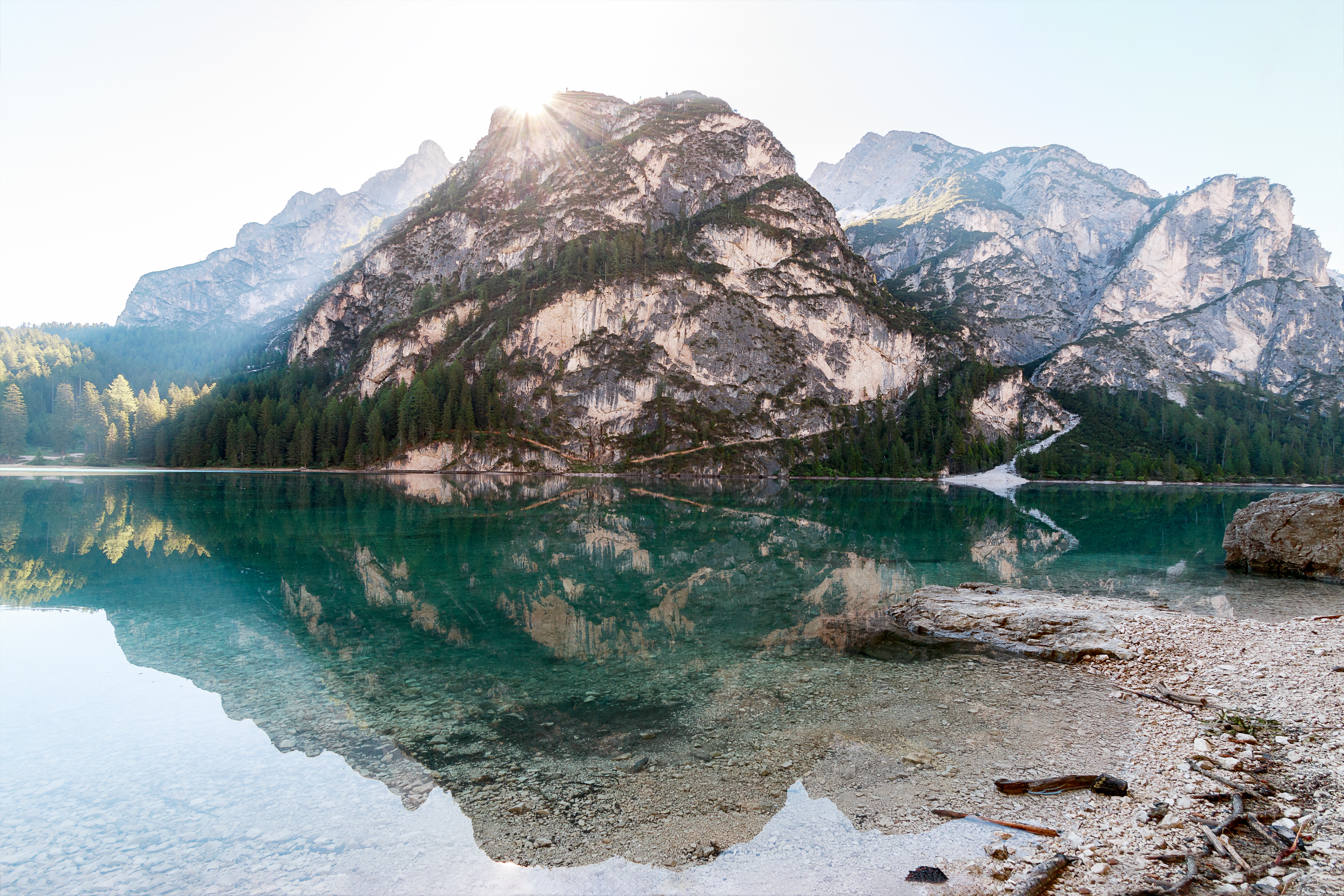 Mountain lake with reflection and rocky shore HD Wallpaper