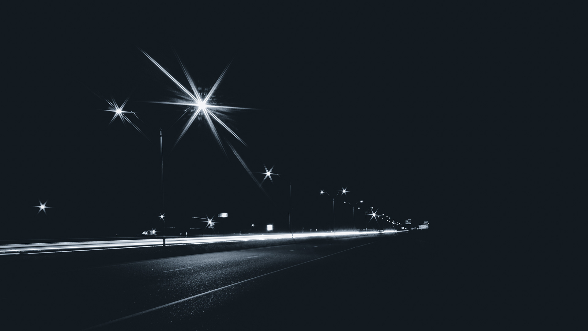 Night highway with light trails and streetlights HD Wallpaper