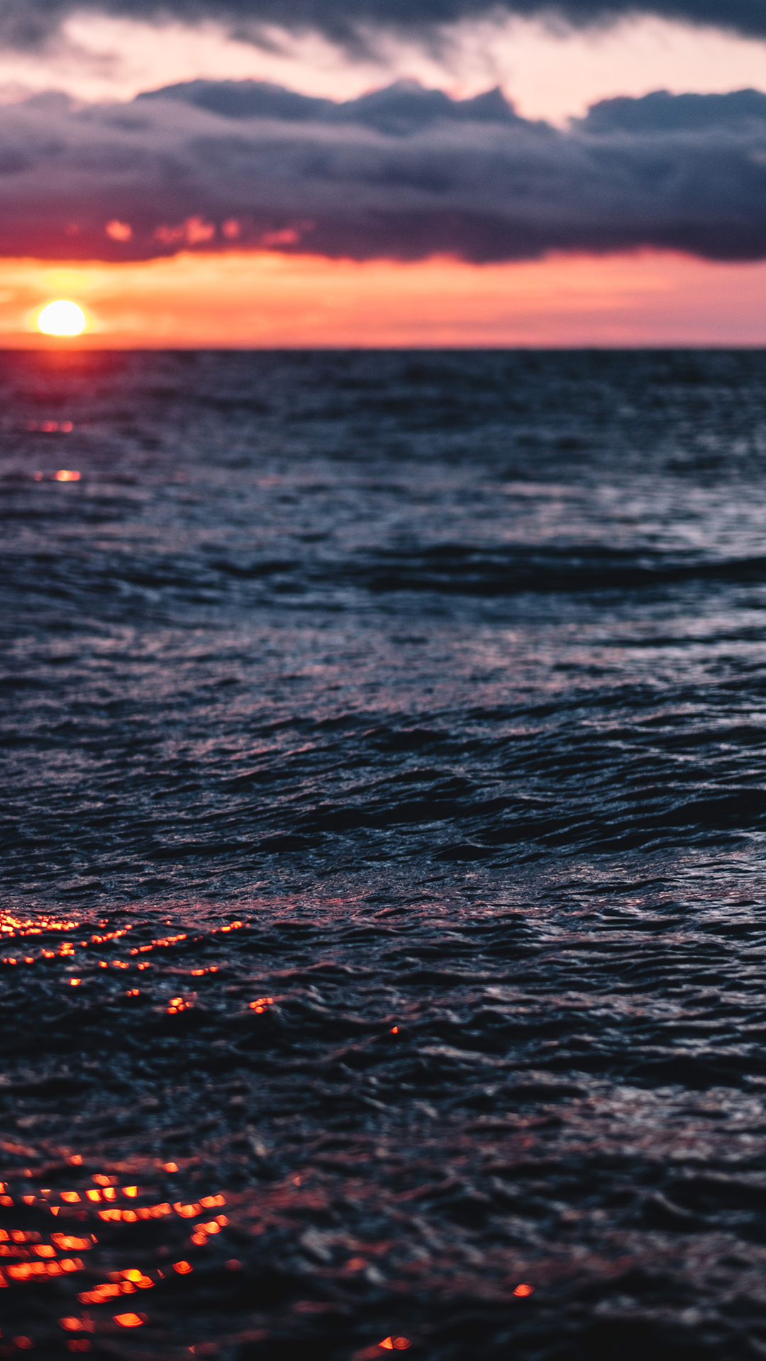 Sunset over the ocean with clouds HD Wallpaper
