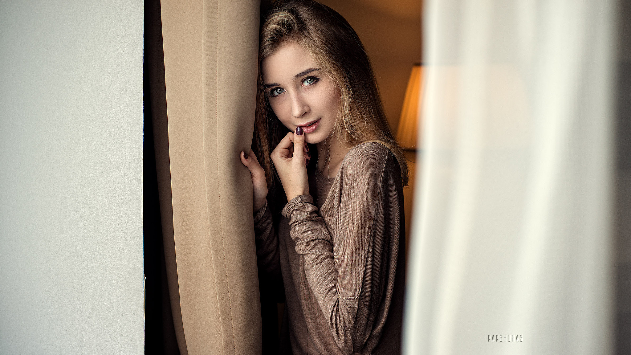 Woman with blonde hair touching her lips HD Wallpaper