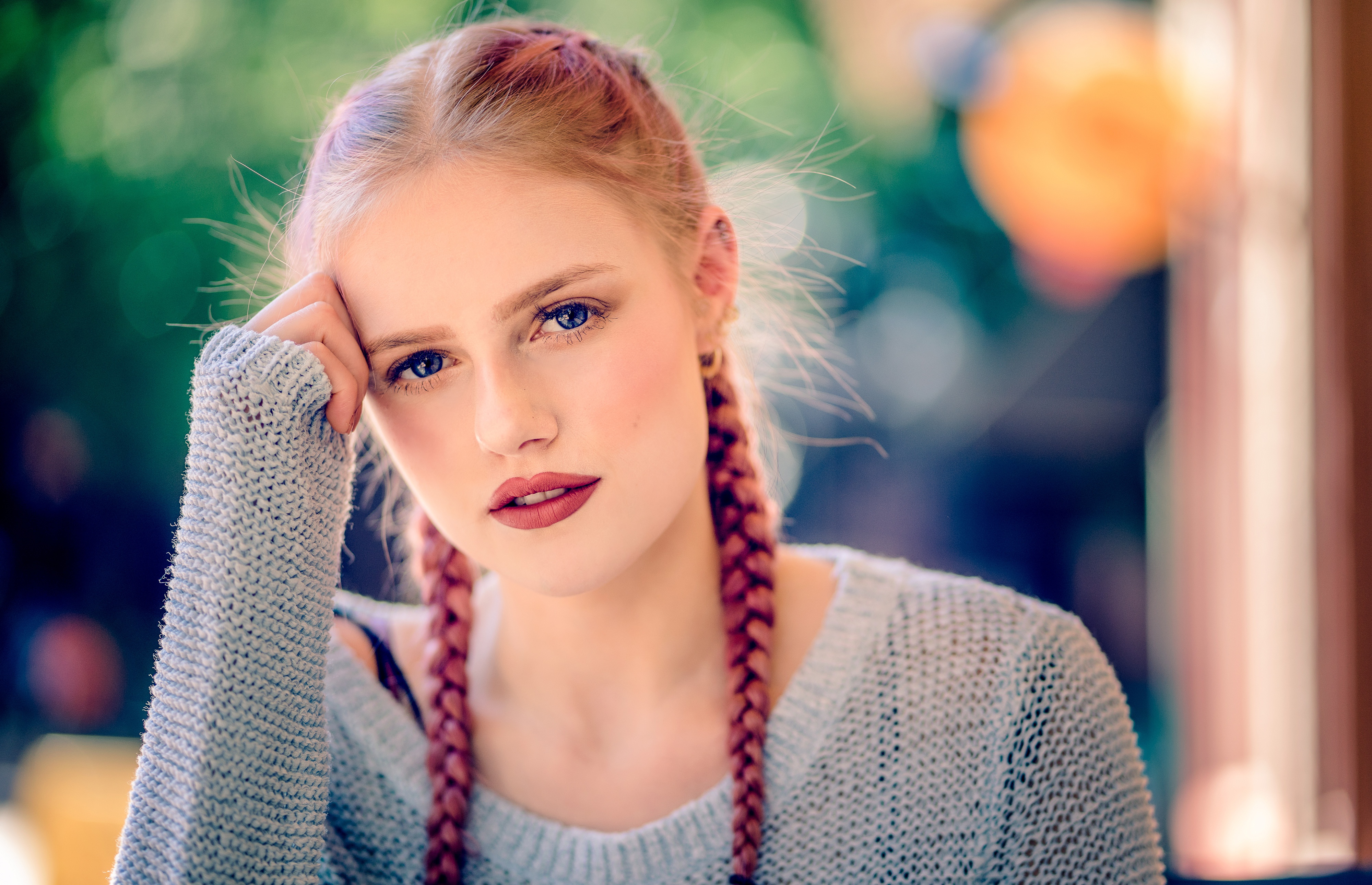 Portrait of a young woman with braids and blue eyes HD Wallpaper
