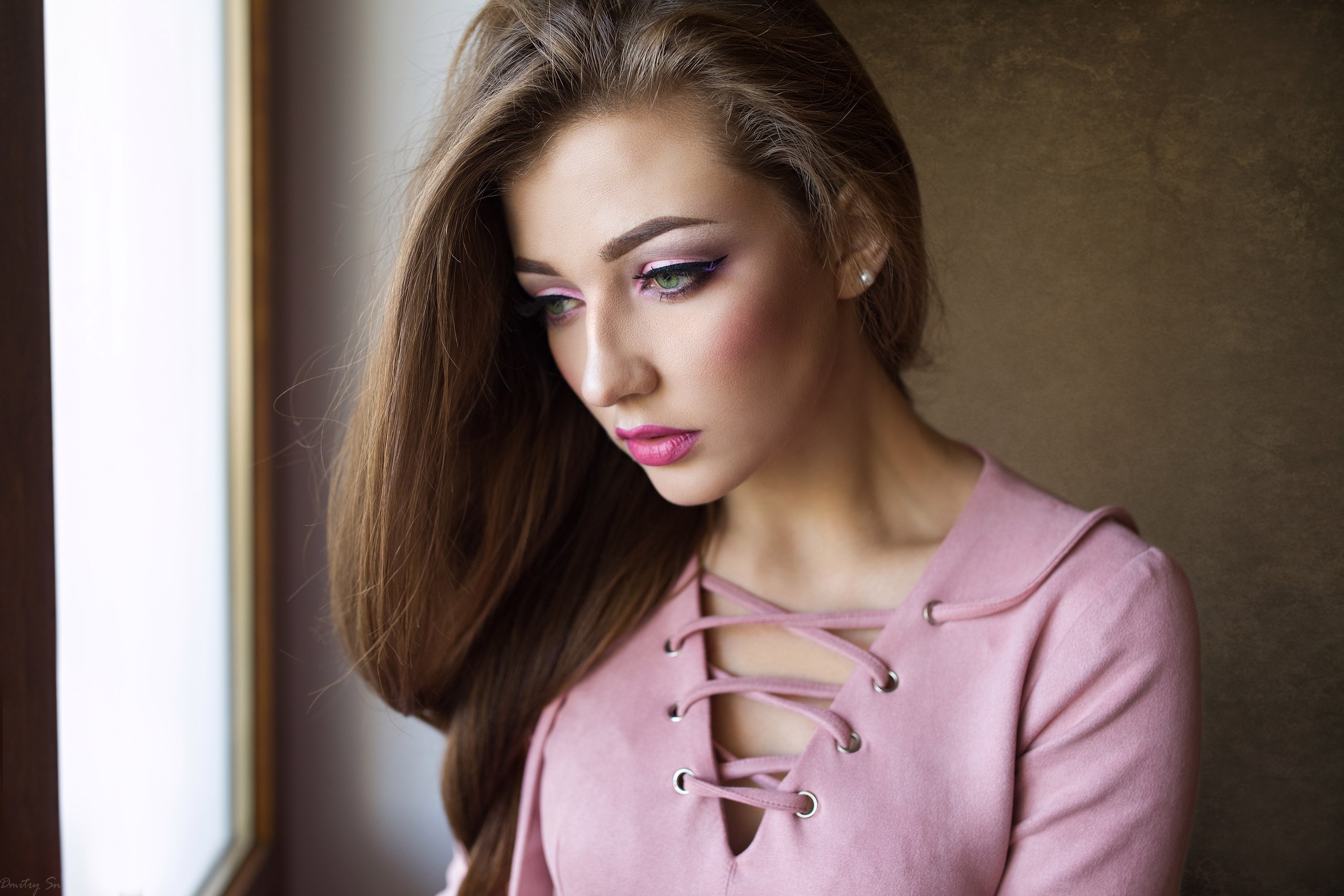 Woman with pink top and makeup looking away HD Wallpaper