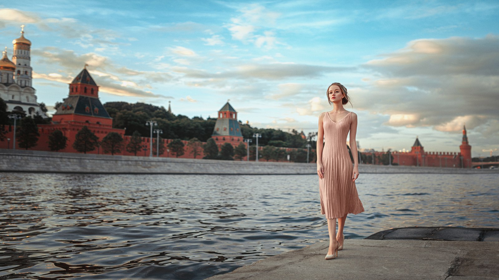 Woman walking by the Moscow Kremlin on the river HD Wallpaper