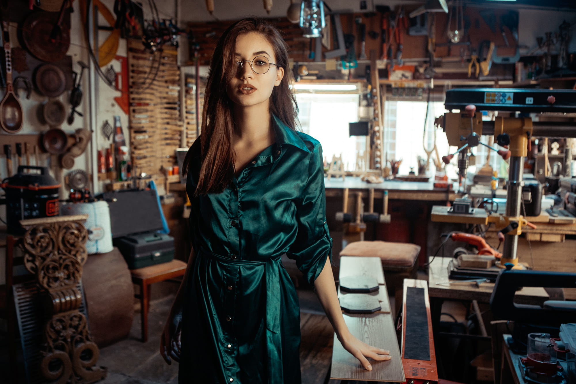 Woman in glasses in a workshop HD Wallpaper