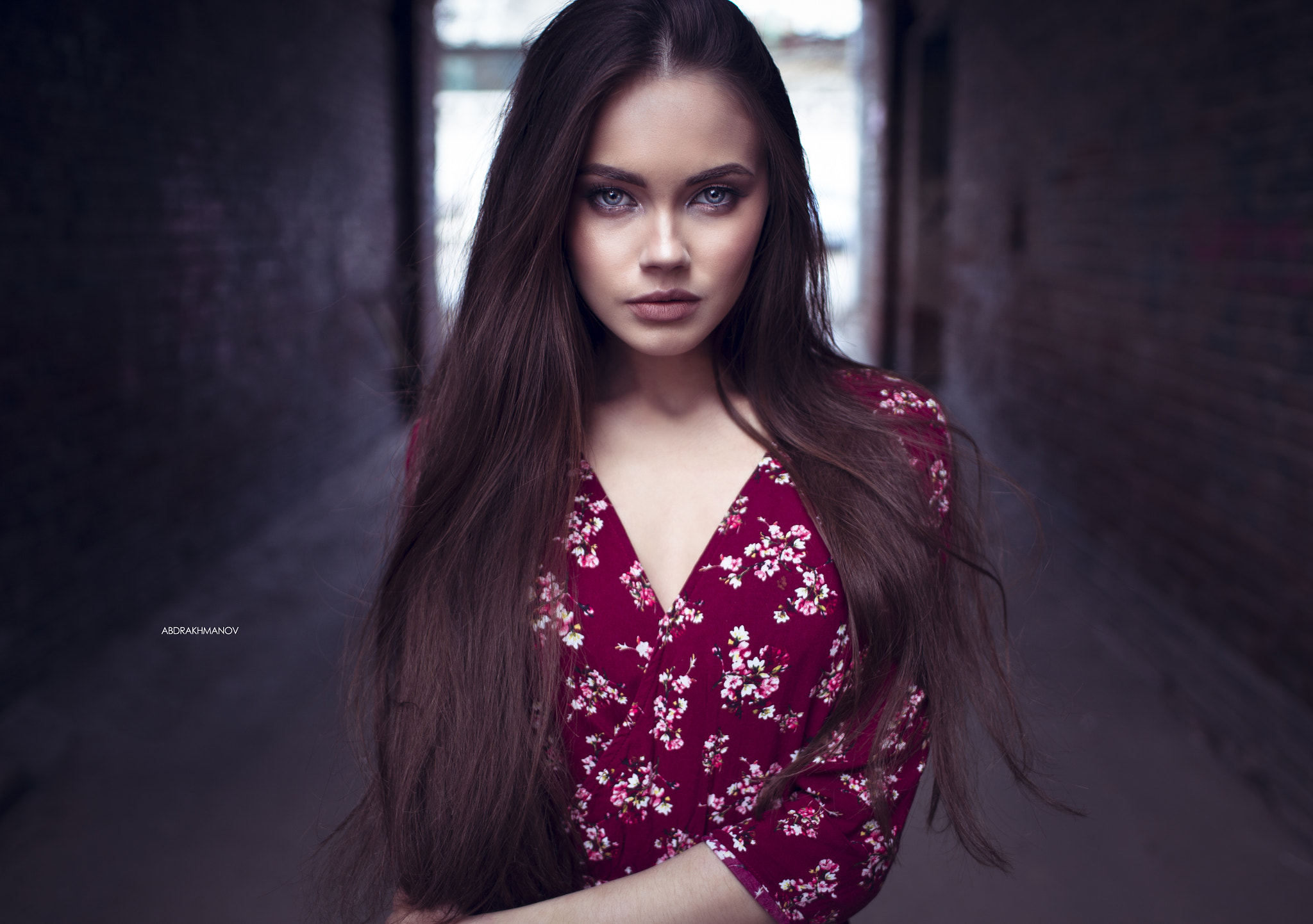 Woman with long brown hair in a floral dress HD Wallpaper