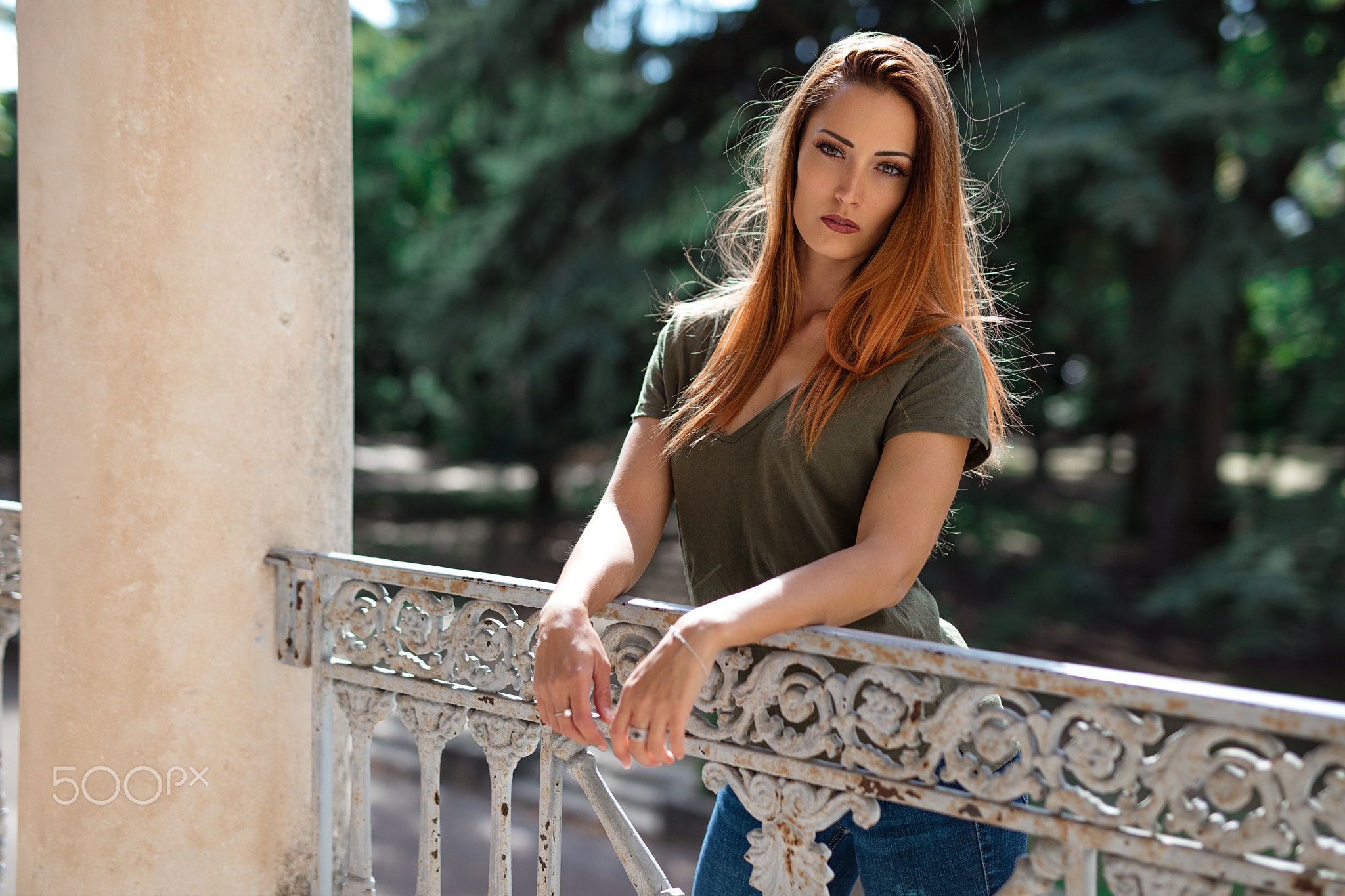 Woman with red hair leaning on a railing HD Wallpaper