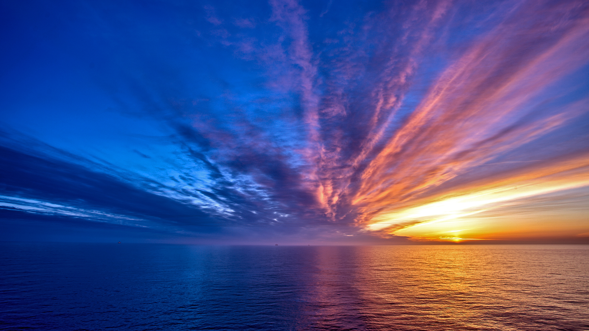 Dramatic sunset over the ocean with colorful clouds HD Wallpaper
