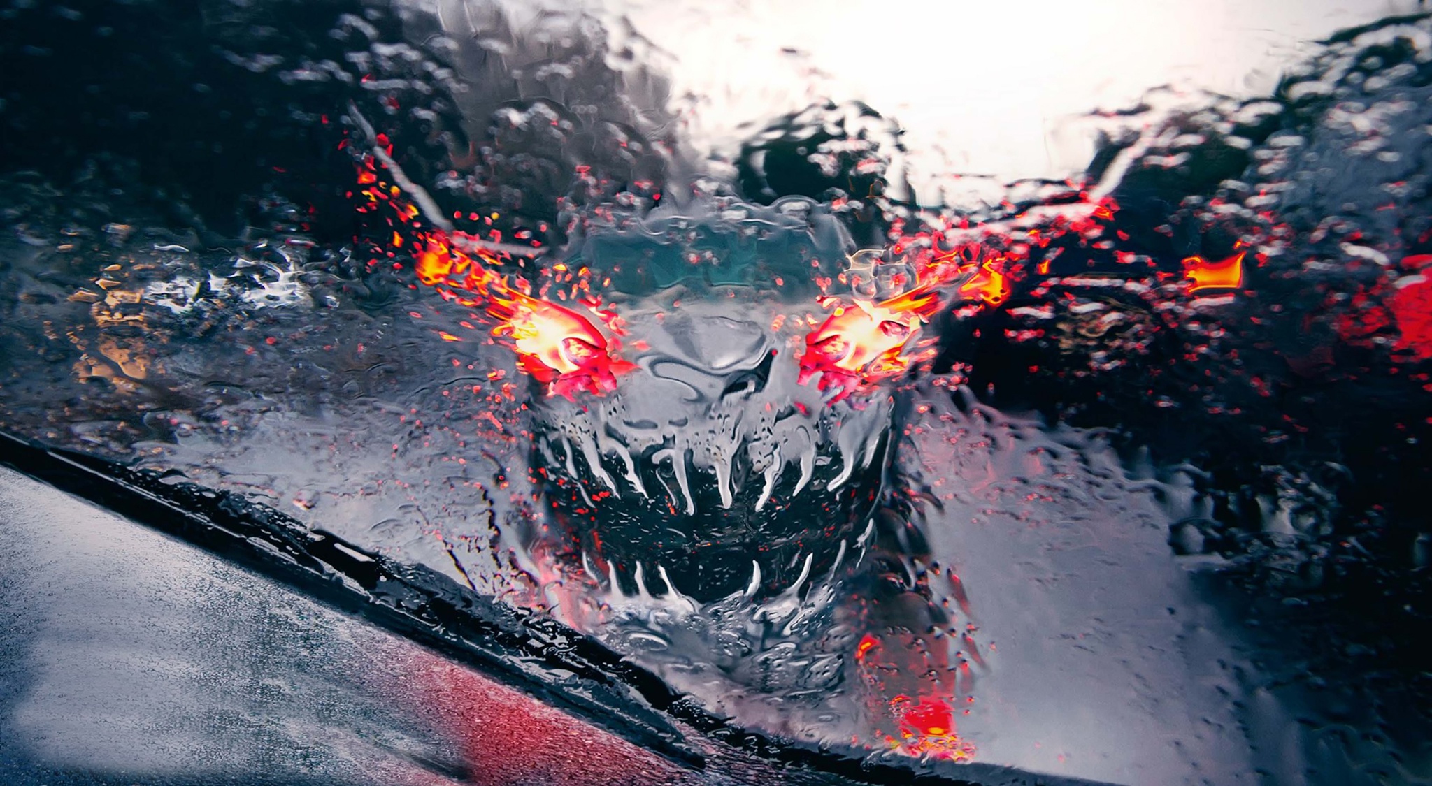 Monster face with fiery eyes on a rainy windshield HD Wallpaper
