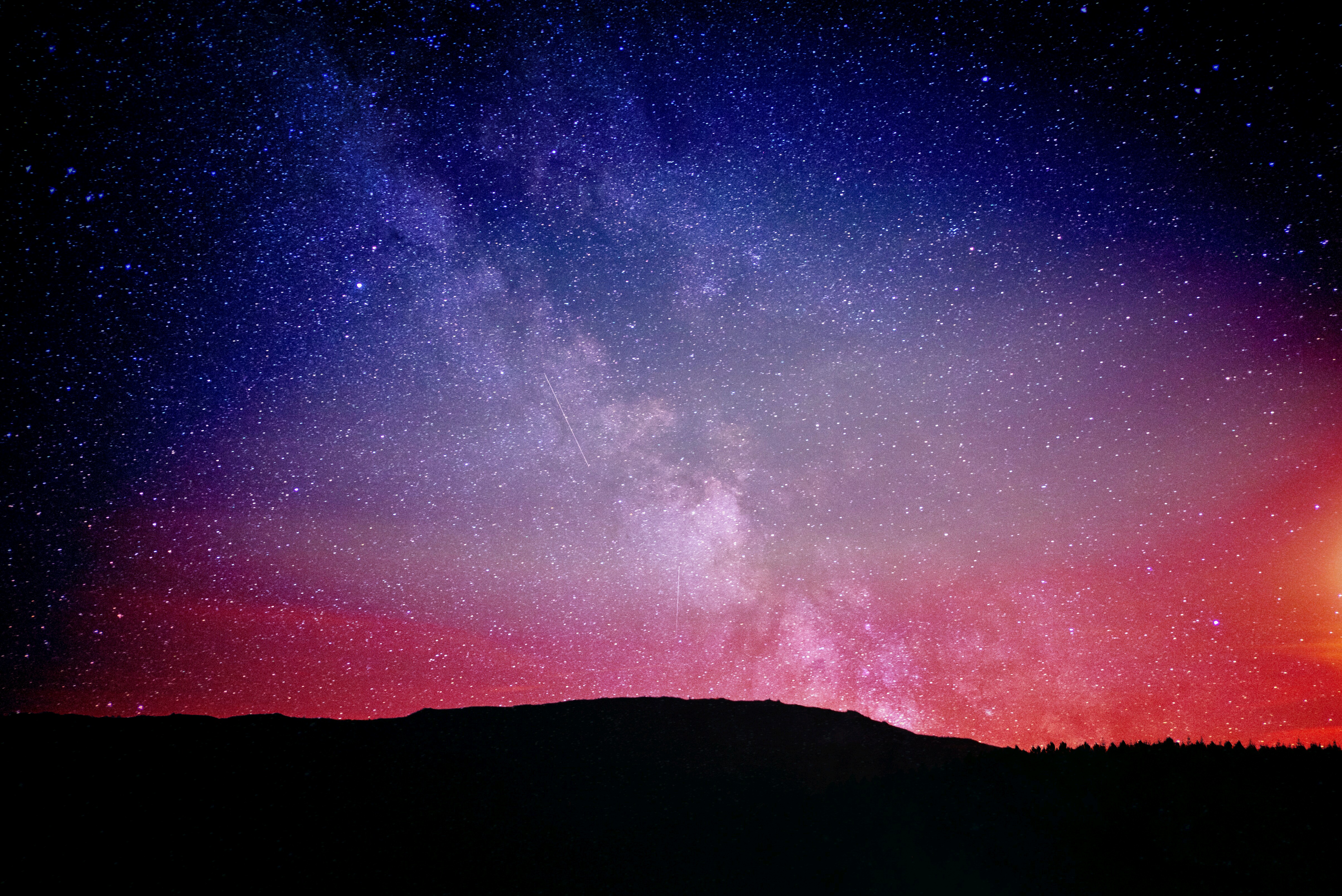Night sky with Milky Way and silhouette of hills HD Wallpaper