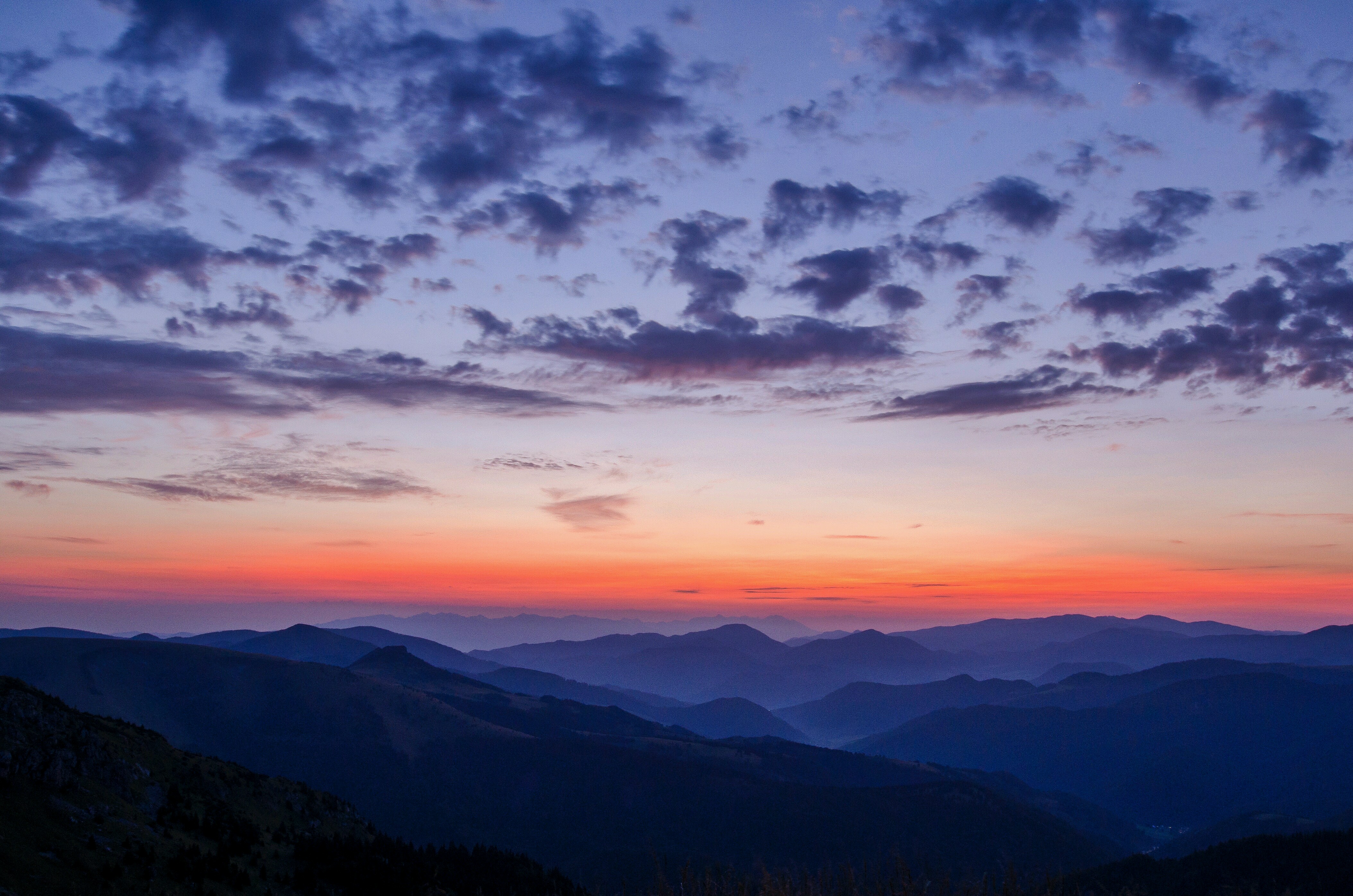 Sunset over misty mountains with clouds HD Wallpaper