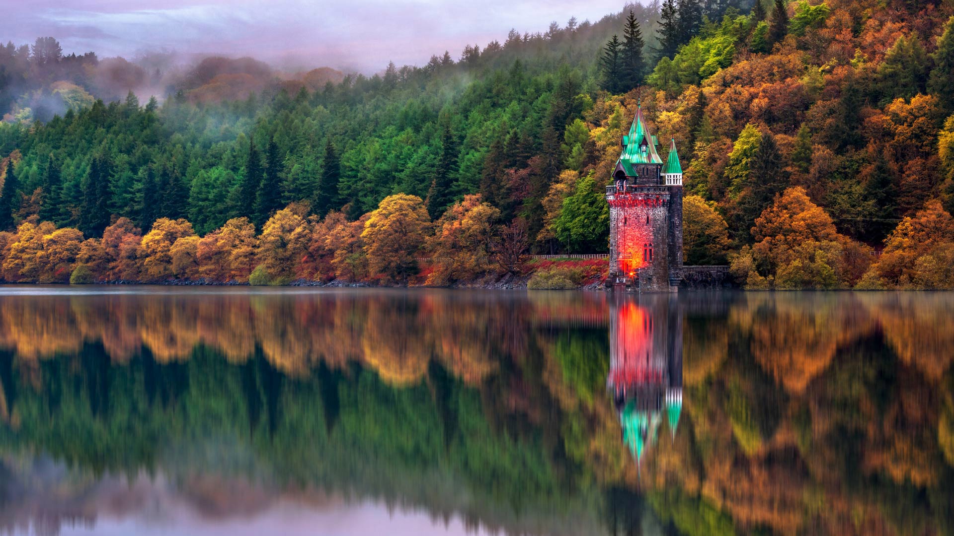 Castle tower on a lake in Wales during autumn HD Wallpaper