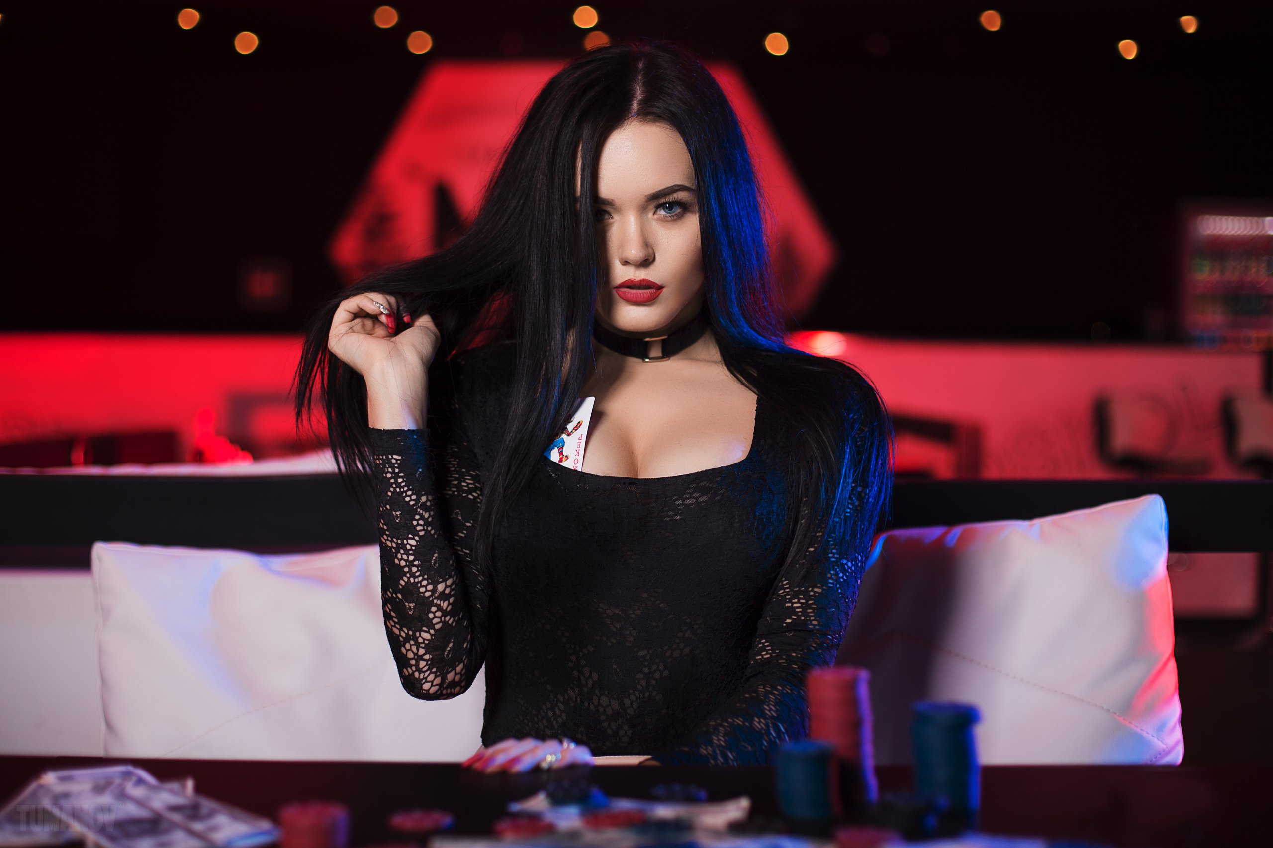 Woman with playing cards in a casino HD Wallpaper
