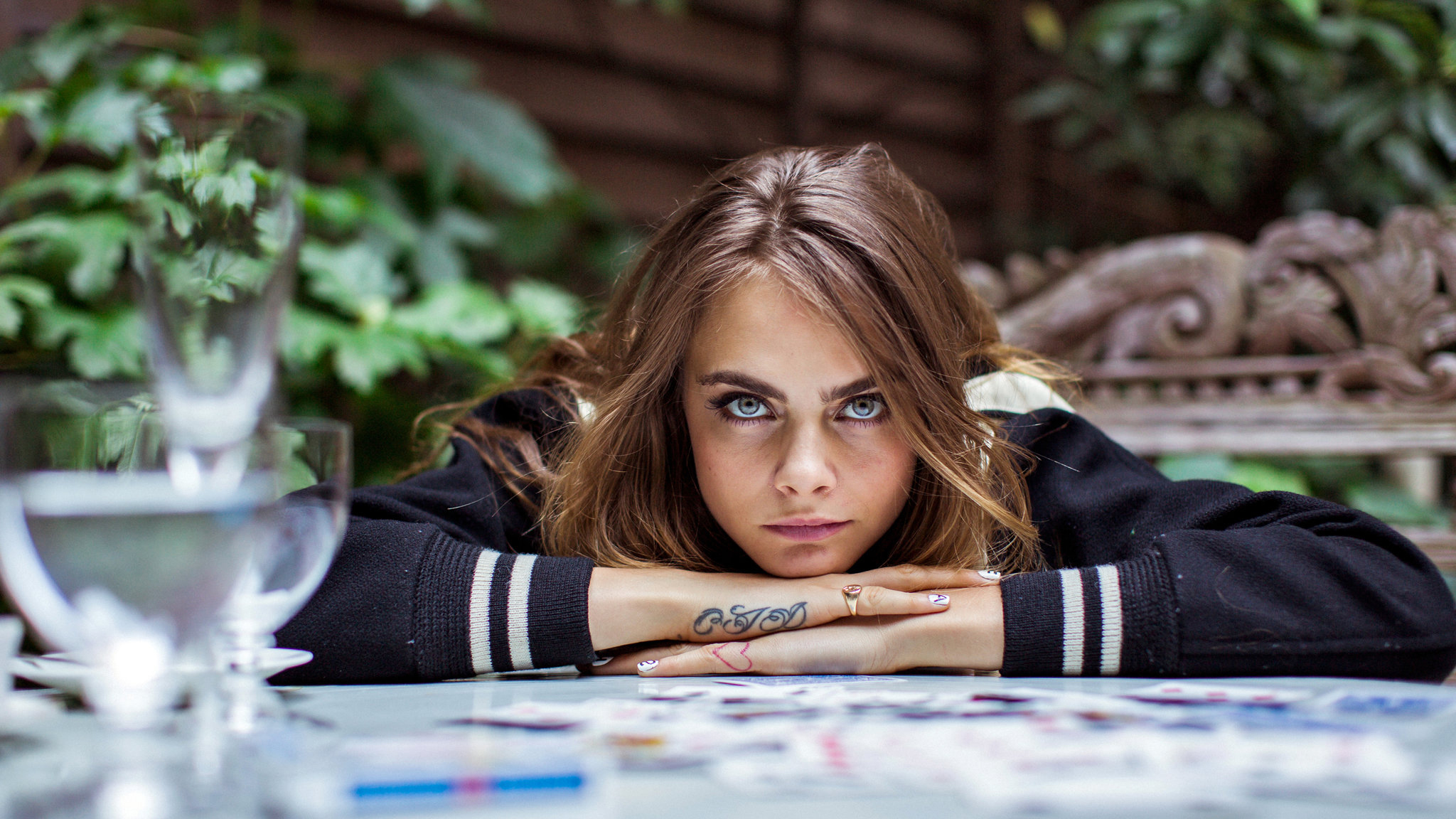 Cara Delevingne resting her head on her arms HD Wallpaper