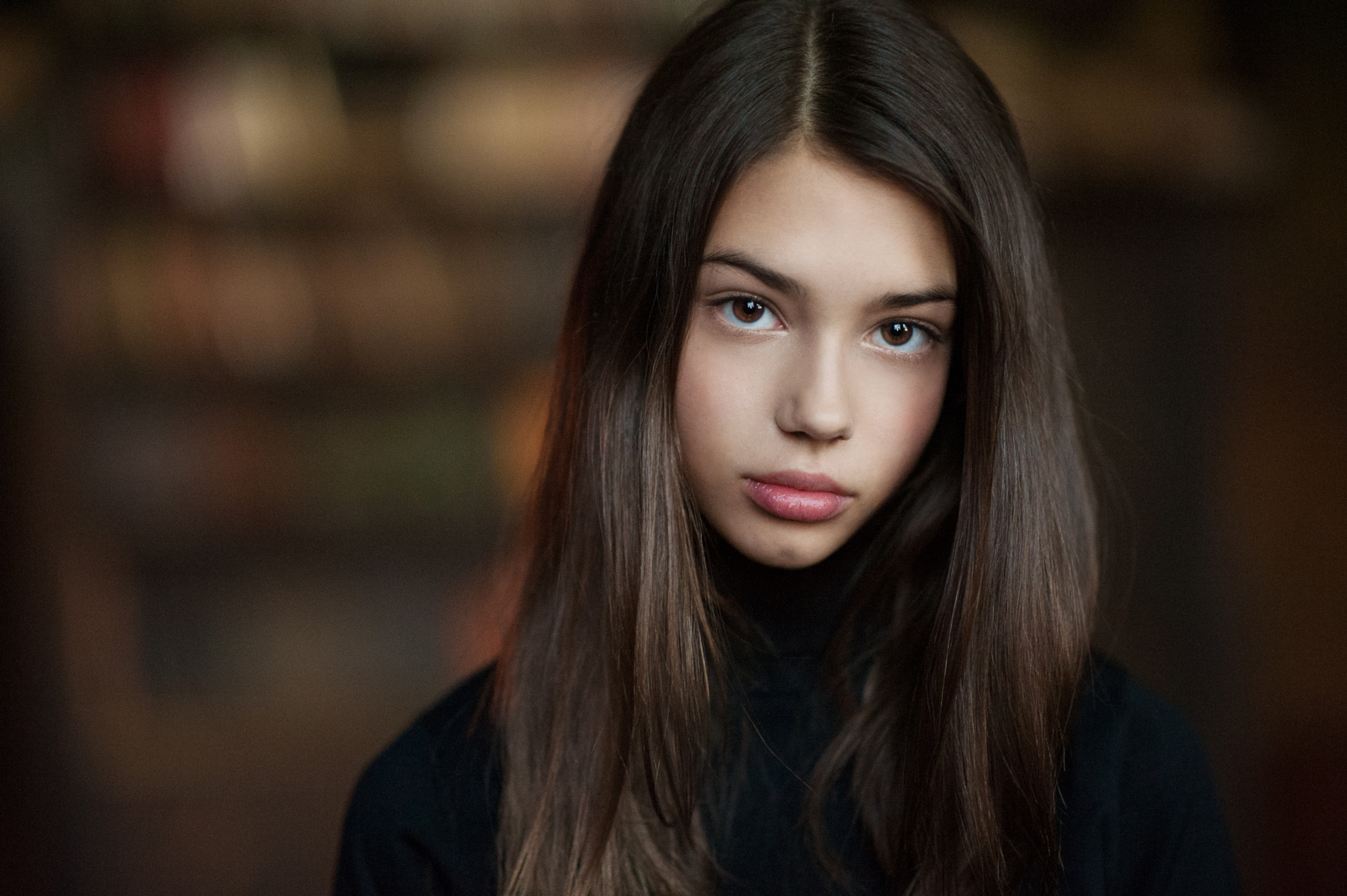 Young woman with long brown hair looking at viewer HD Wallpaper