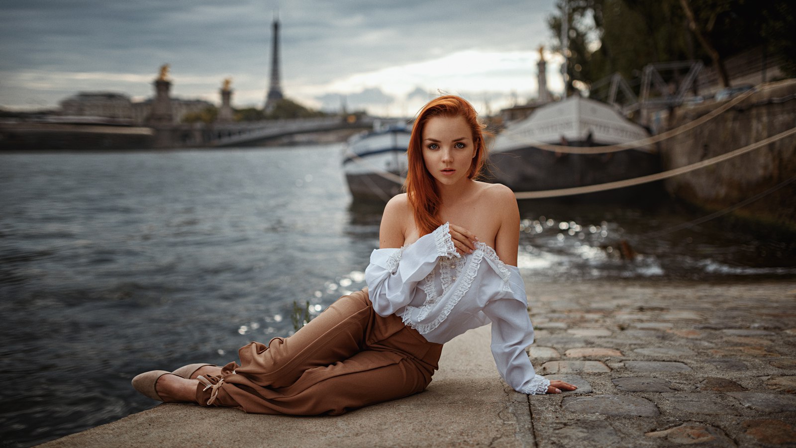 Woman posing by the Seine River in Paris HD Wallpaper