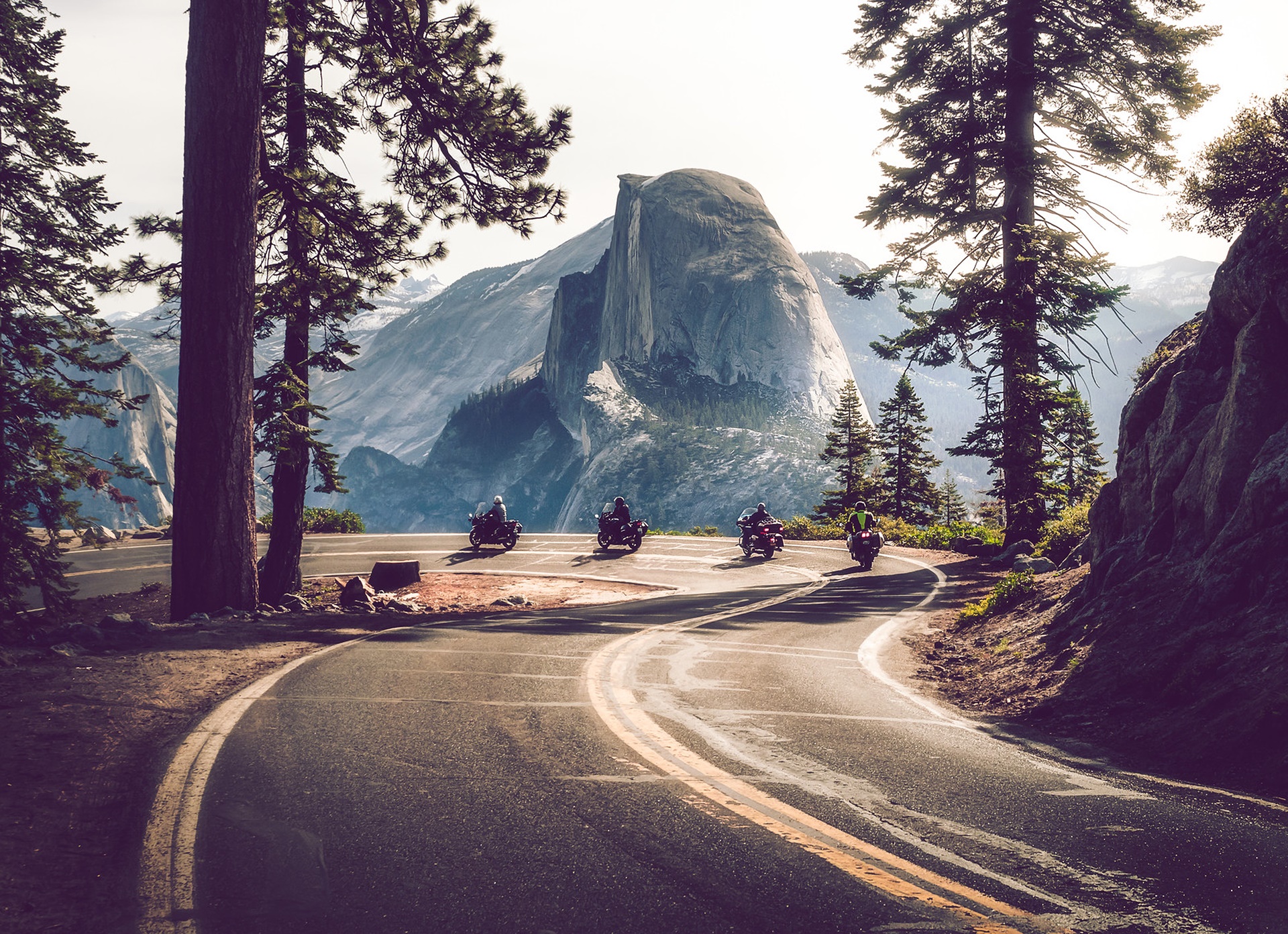 Motorcyclists on a road in Yosemite National Park HD Wallpaper