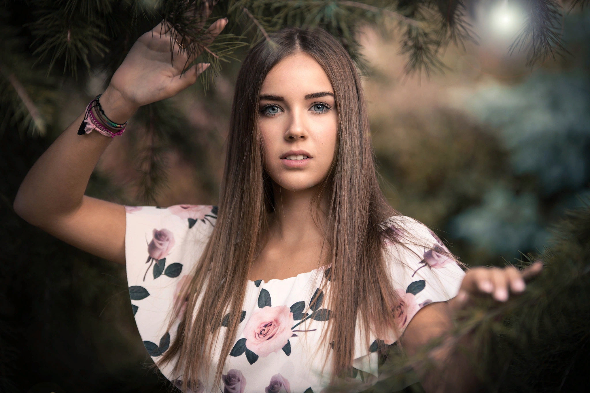 Young woman with long brown hair and blue eyes HD Wallpaper