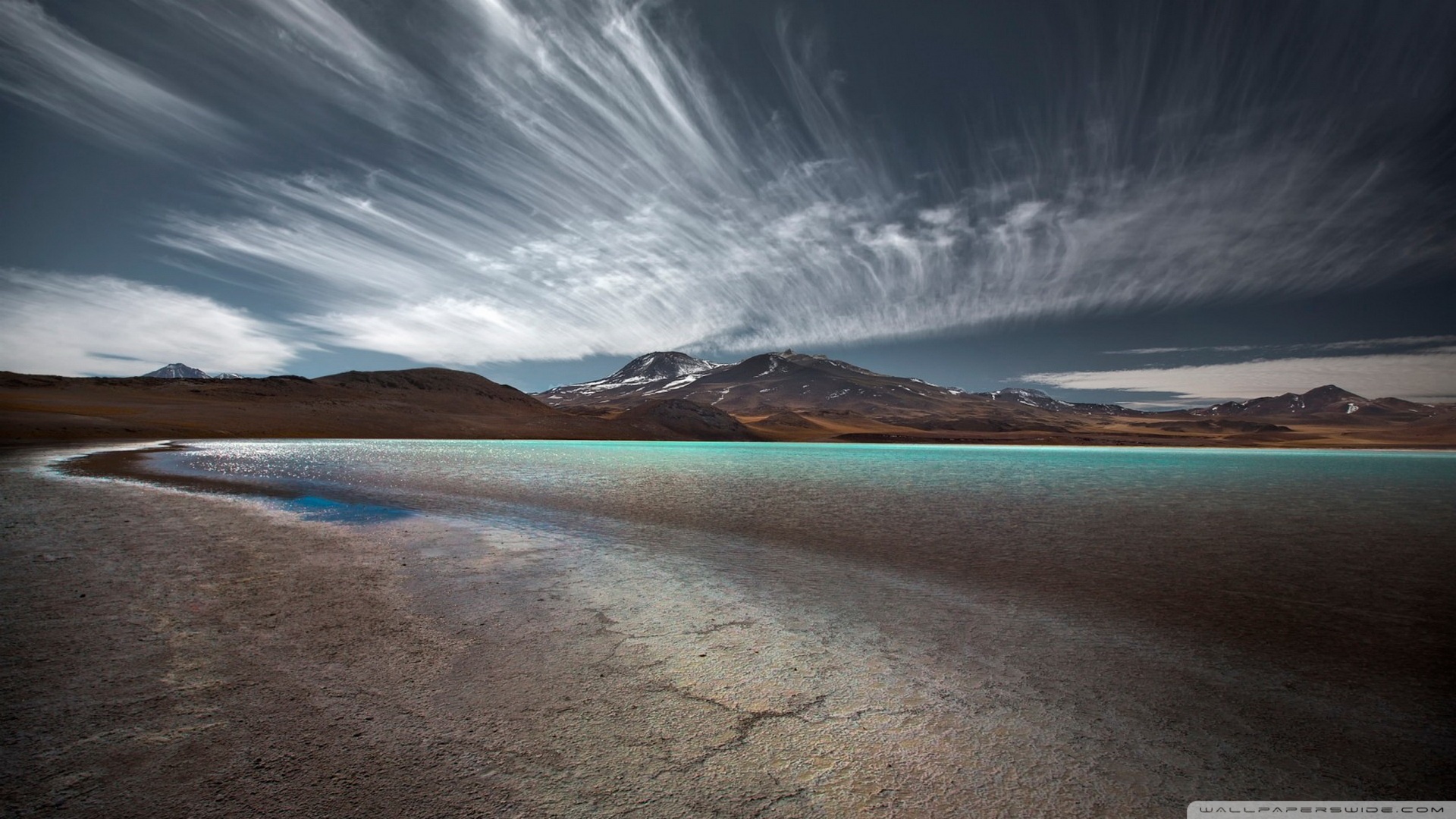 Turquoise lake and mountains under dramatic sky HD Wallpaper