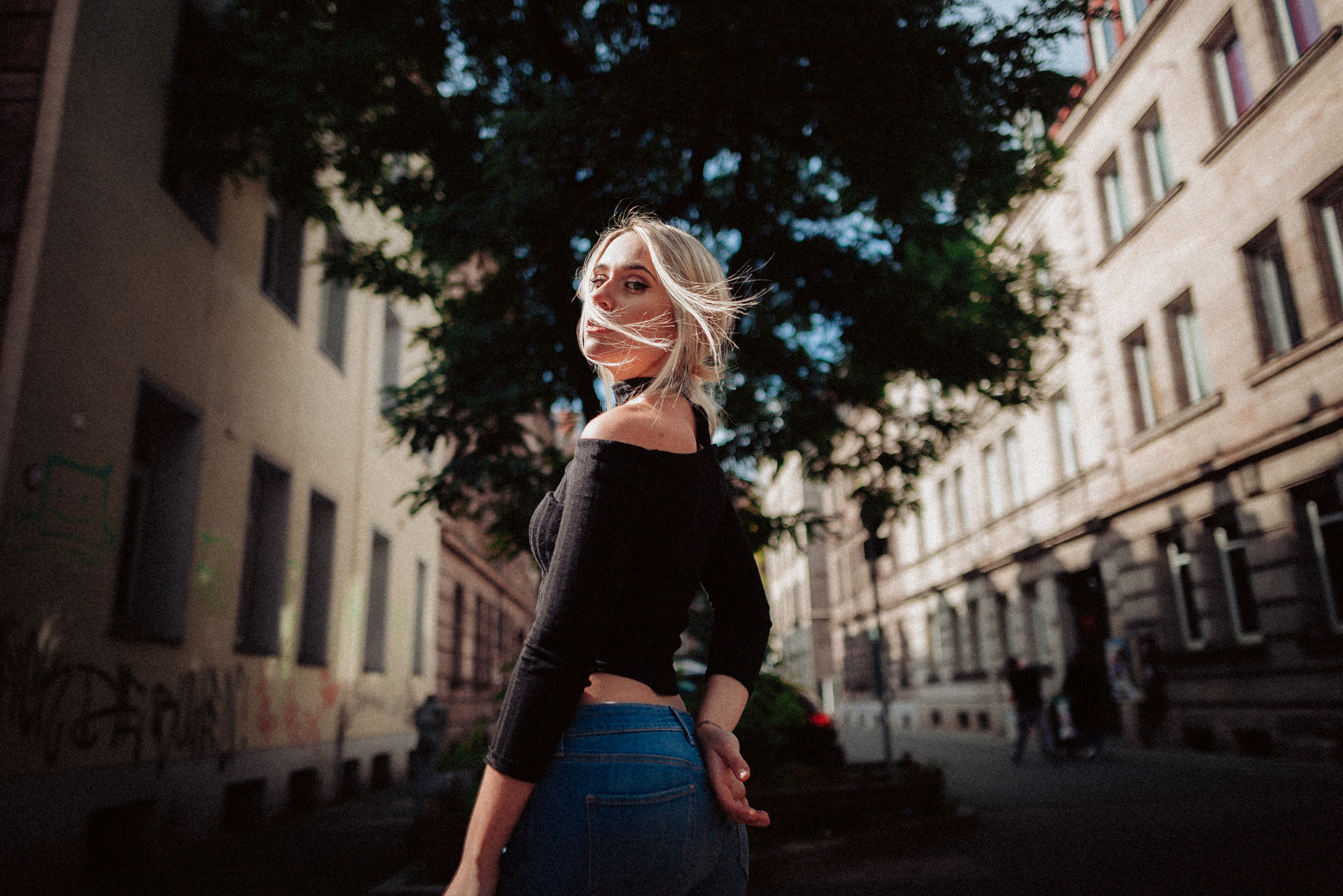 Woman in black top and jeans outdoors HD Wallpaper