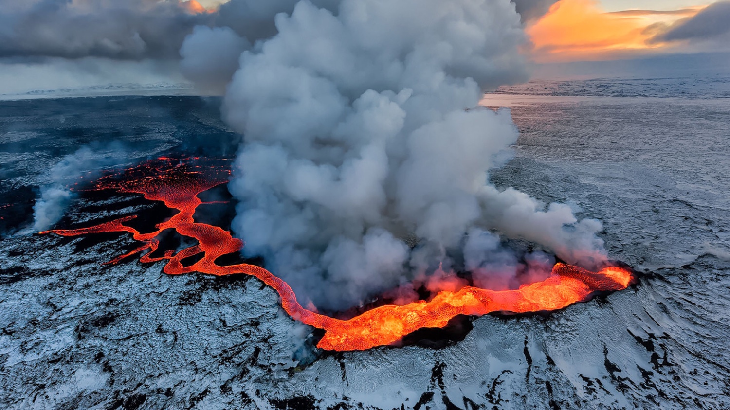 Volcano erupting with lava flow and smoke HD Wallpaper