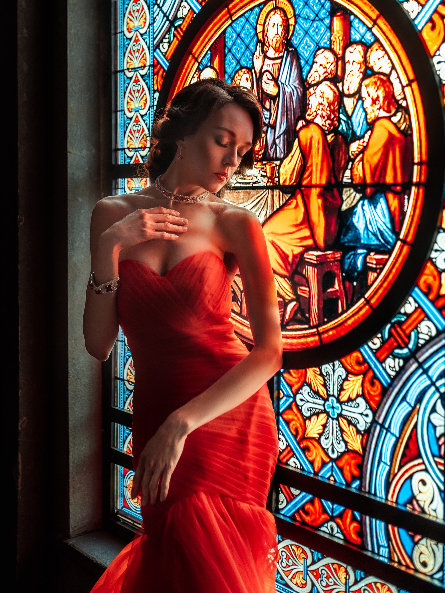 Woman in red dress by stained glass window HD Wallpaper
