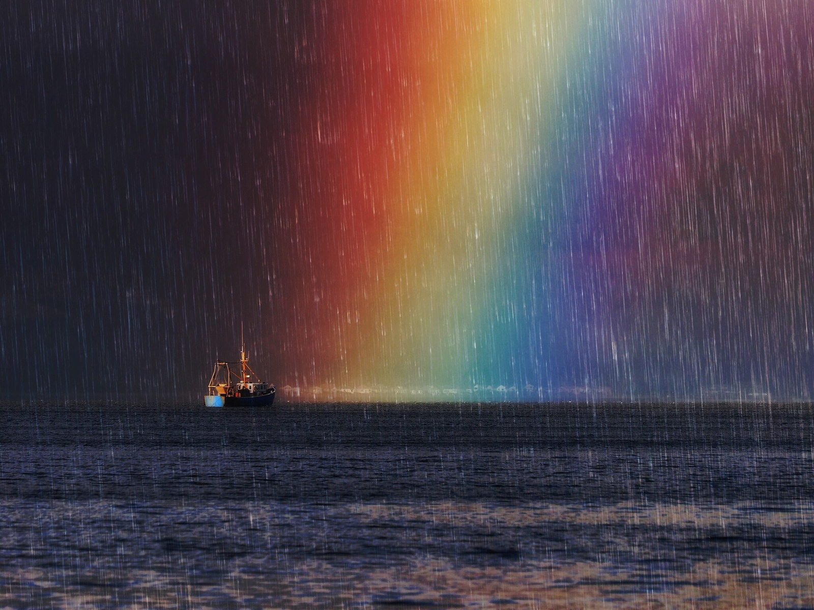 Fishing boat in the sea during a rainbow and rain HD Wallpaper