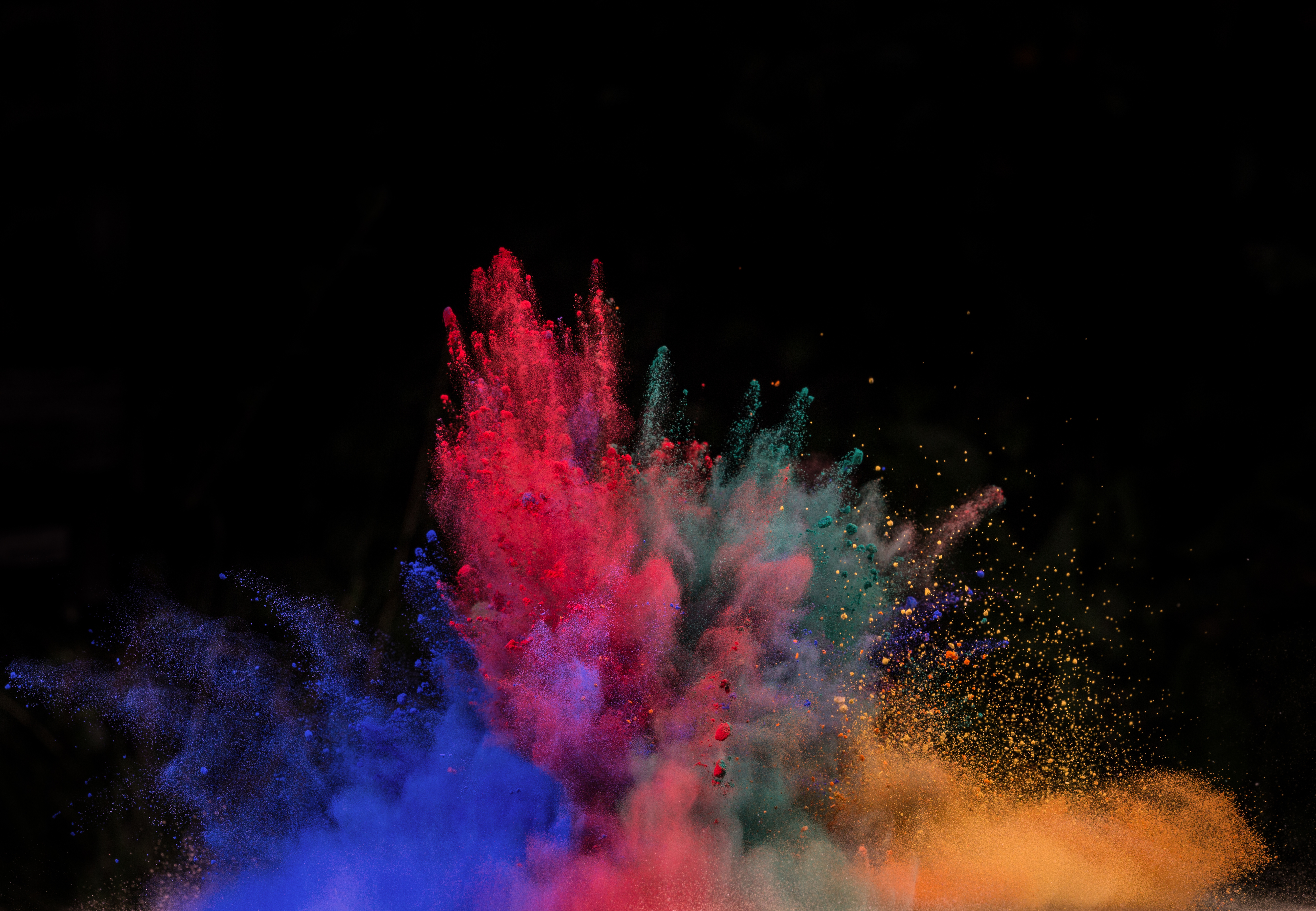Colorful powder explosion against black background HD Wallpaper