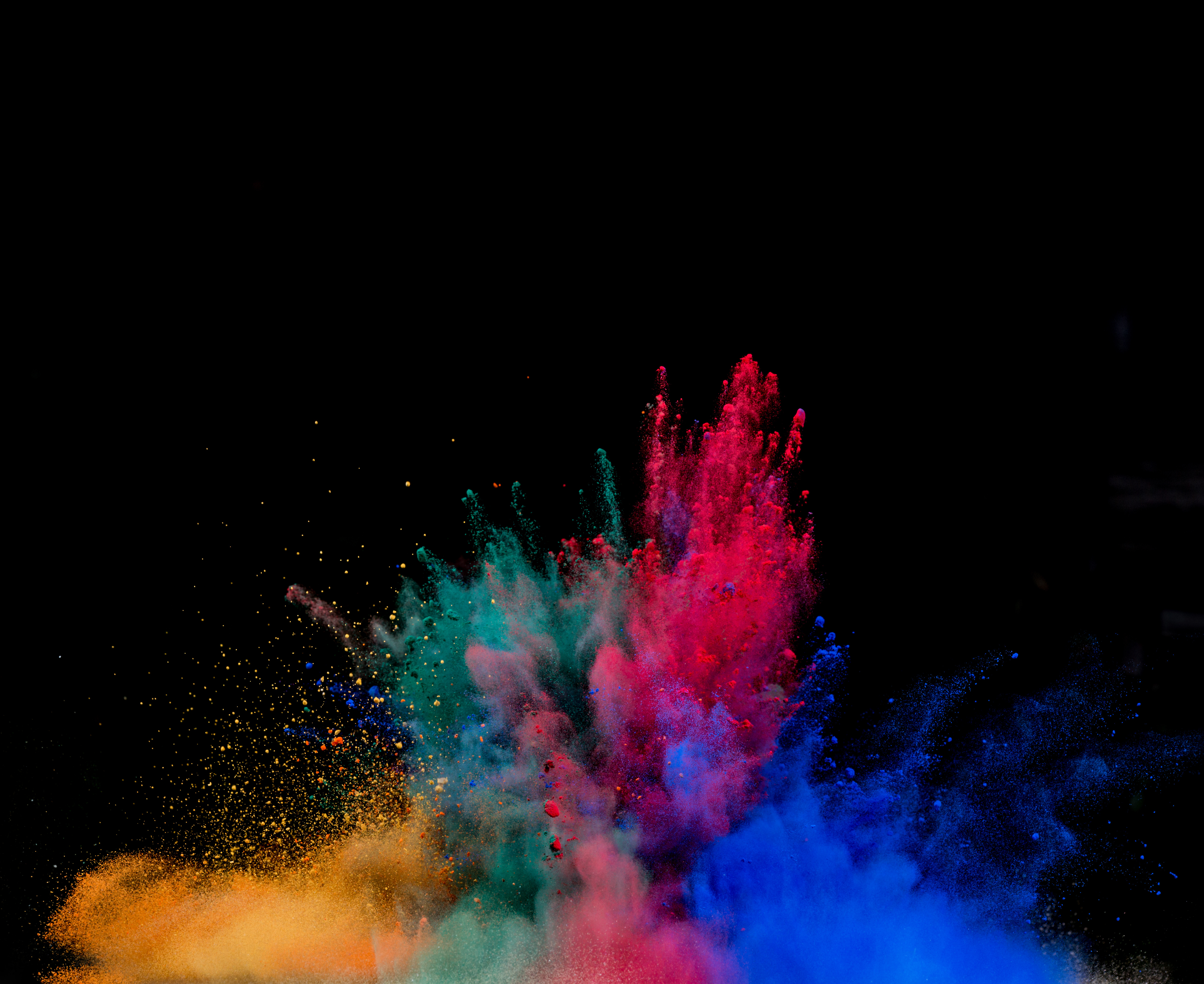 Colorful powder explosion against black background HD Wallpaper