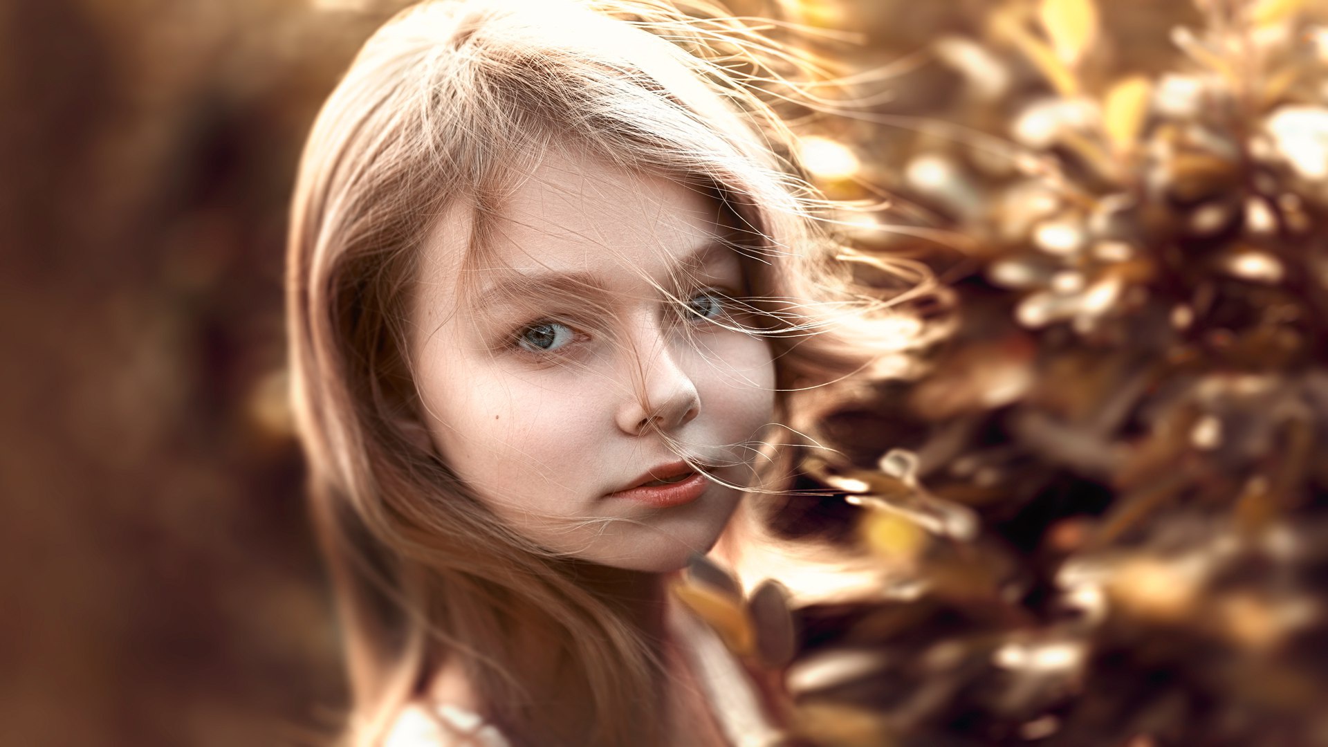 Young girl with blonde hair in the wind HD Wallpaper