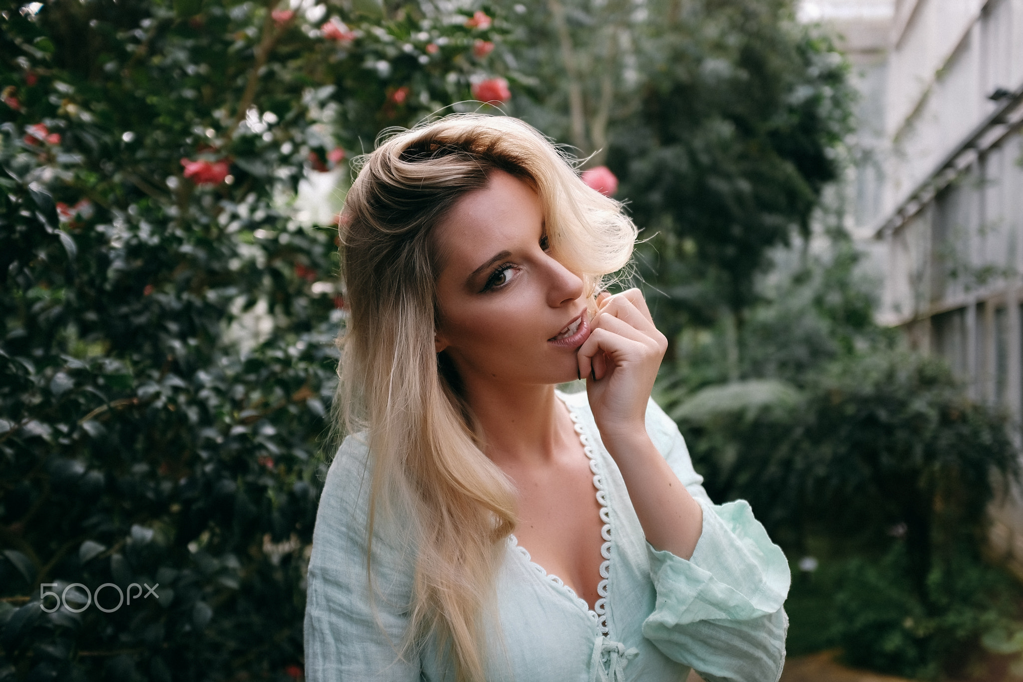 Woman with blonde hair in a garden HD Wallpaper